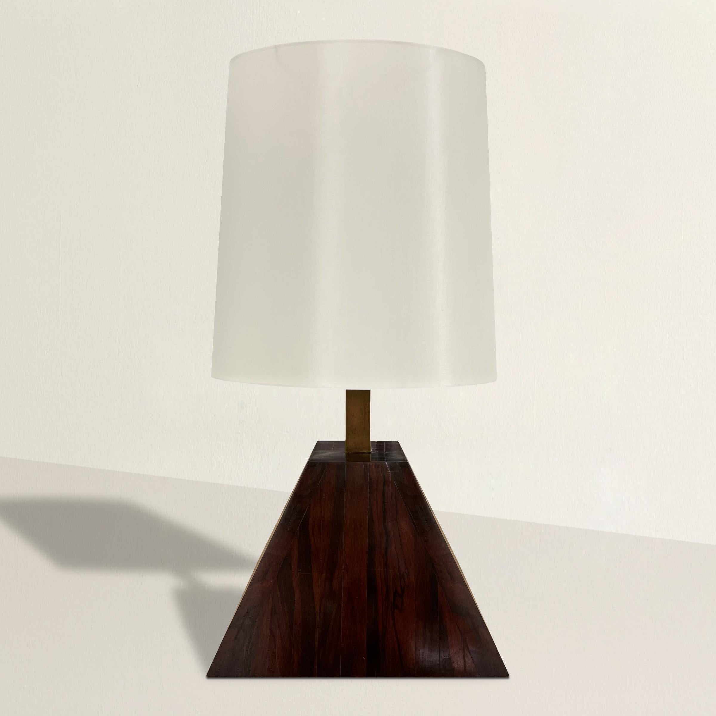 A rather large mid-20th century Italian table lamp designed by Italian designer Romeo Rega, with a pyramidal-form teak wood base with a brass stem supporting a tapered oval silk shade. The scale is pretty impressive!