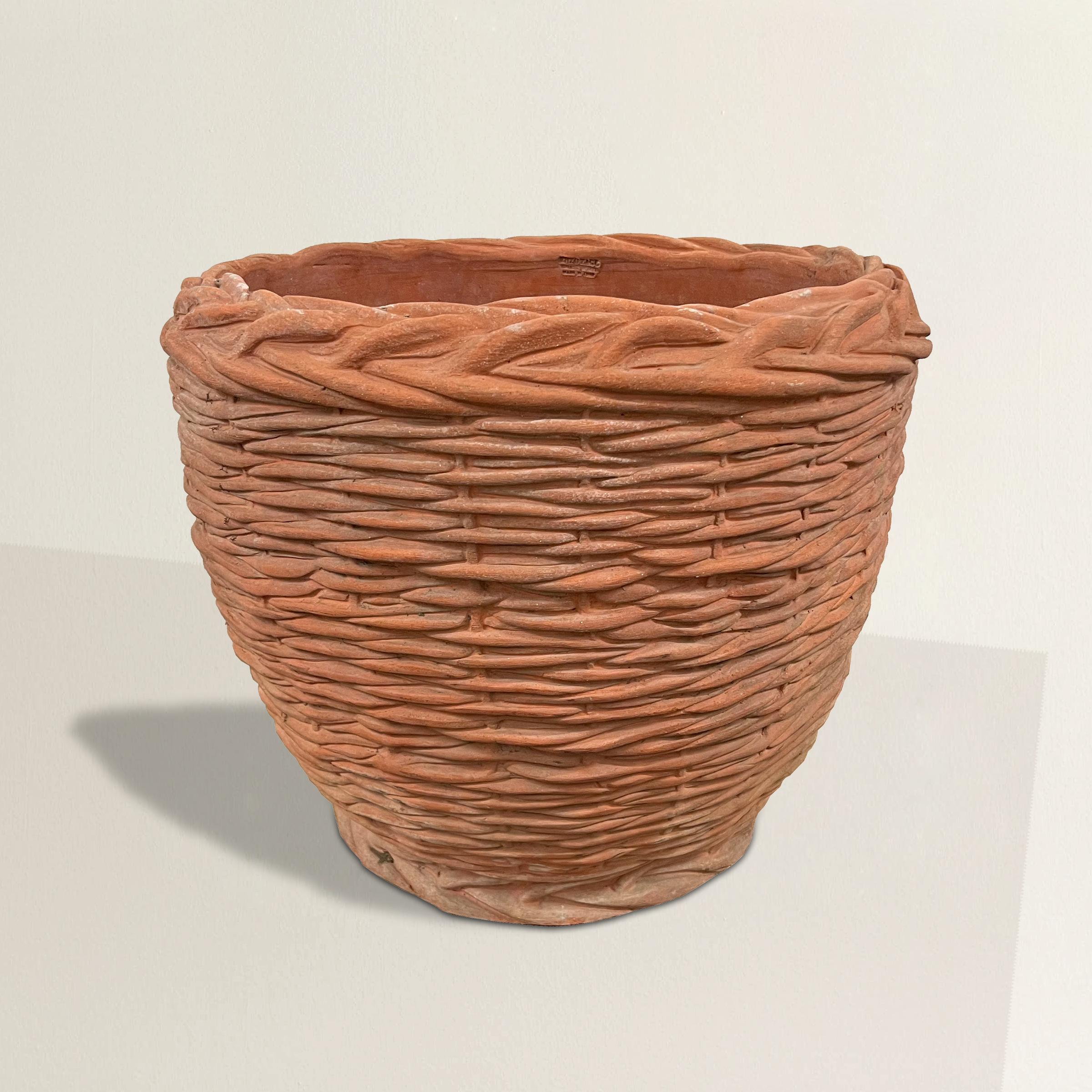 Experience the allure of Italian terracotta artistry with this remarkable vintage hand-built woven basket-form pot from the renowned Tuscan workshop of Enzo Zago. Crafted with meticulous attention to detail, it captures the essence of traditional