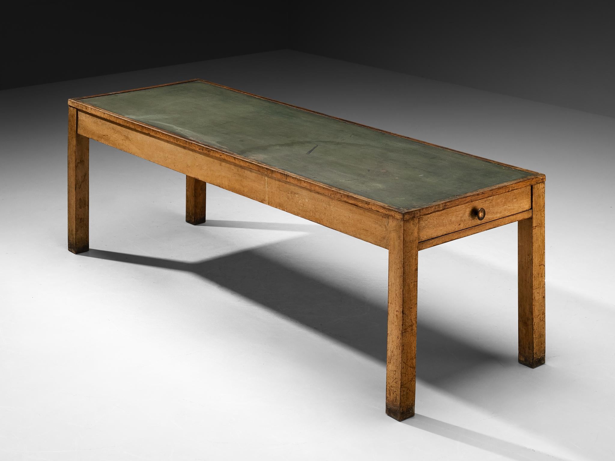 Dining / work / conference table, walnut, linoleum, brass, Italy, 1930s

This table embodies the rationalist design principles of the 1930s, where clarity of structure and functional simplicity defined the aesthetic. Its shape is linear and strictly