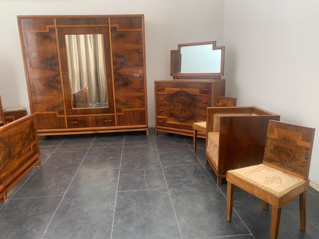 Rationalist-style bedroom in walnut, walnut root and maple. Beautiful handles in chrome metal and pastel orange bakelite. On the tops there is a fabric storage compartment with glass above. The lines echo the designs of Marcello Piacentini and
