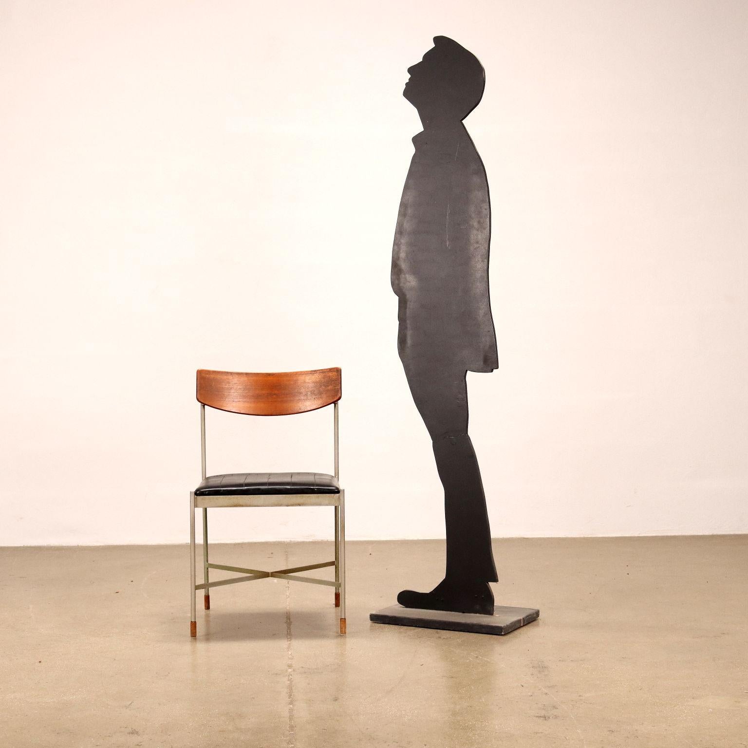 Chair, metal, back and tips in teak wood, seat in foam with imitation leather covering.