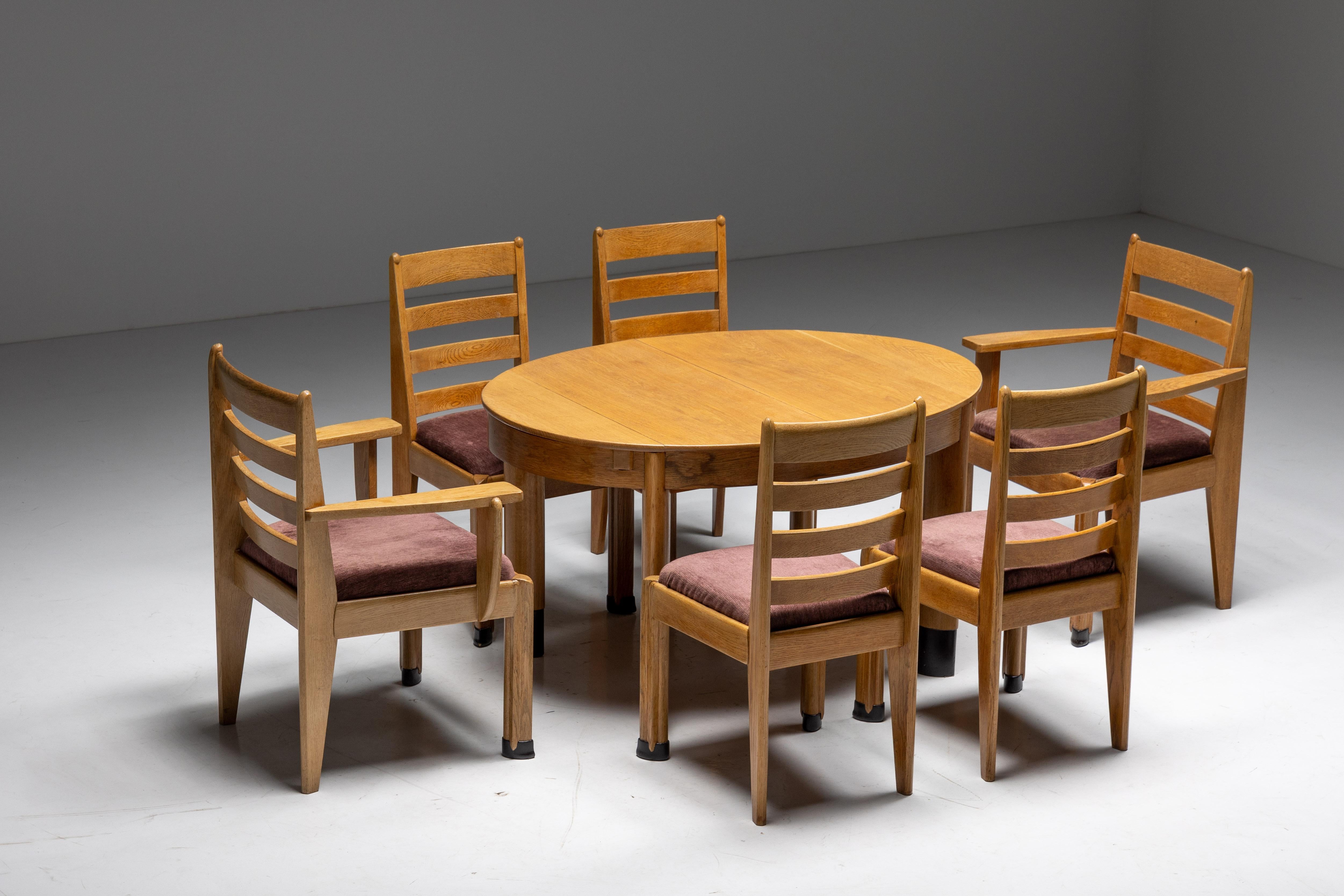 Oak dining set, Dutch Art Deco era, Hague school, 1928

Oval dining table in oak, on juxtaposed oval legs, Dutch, 1920s
Rationalist dining chairs, set of four, with sculptural front legs.
Rationalist armchairs, a pair, with sculptural arms and
