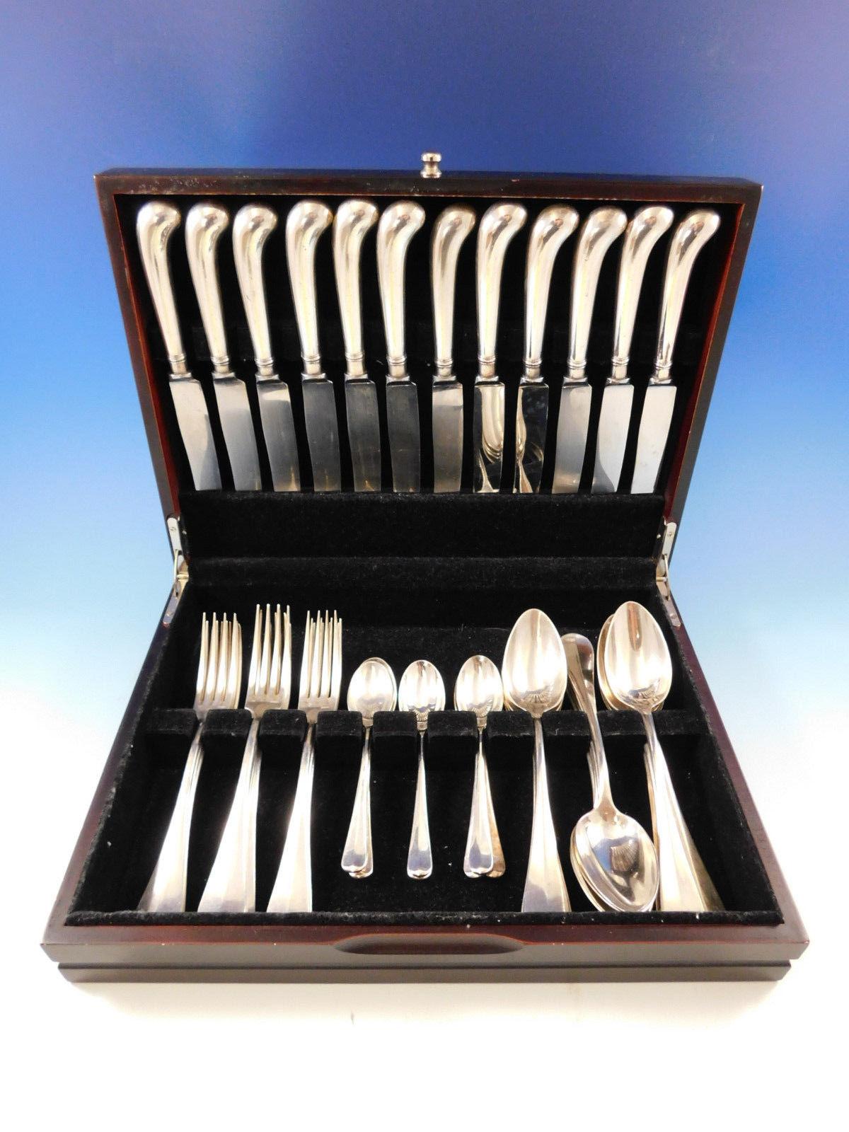 Dinner size Rattail by Robert Belk & French silverplate flatware set, 42 pieces. This set includes:

12 dinner size knives, 10