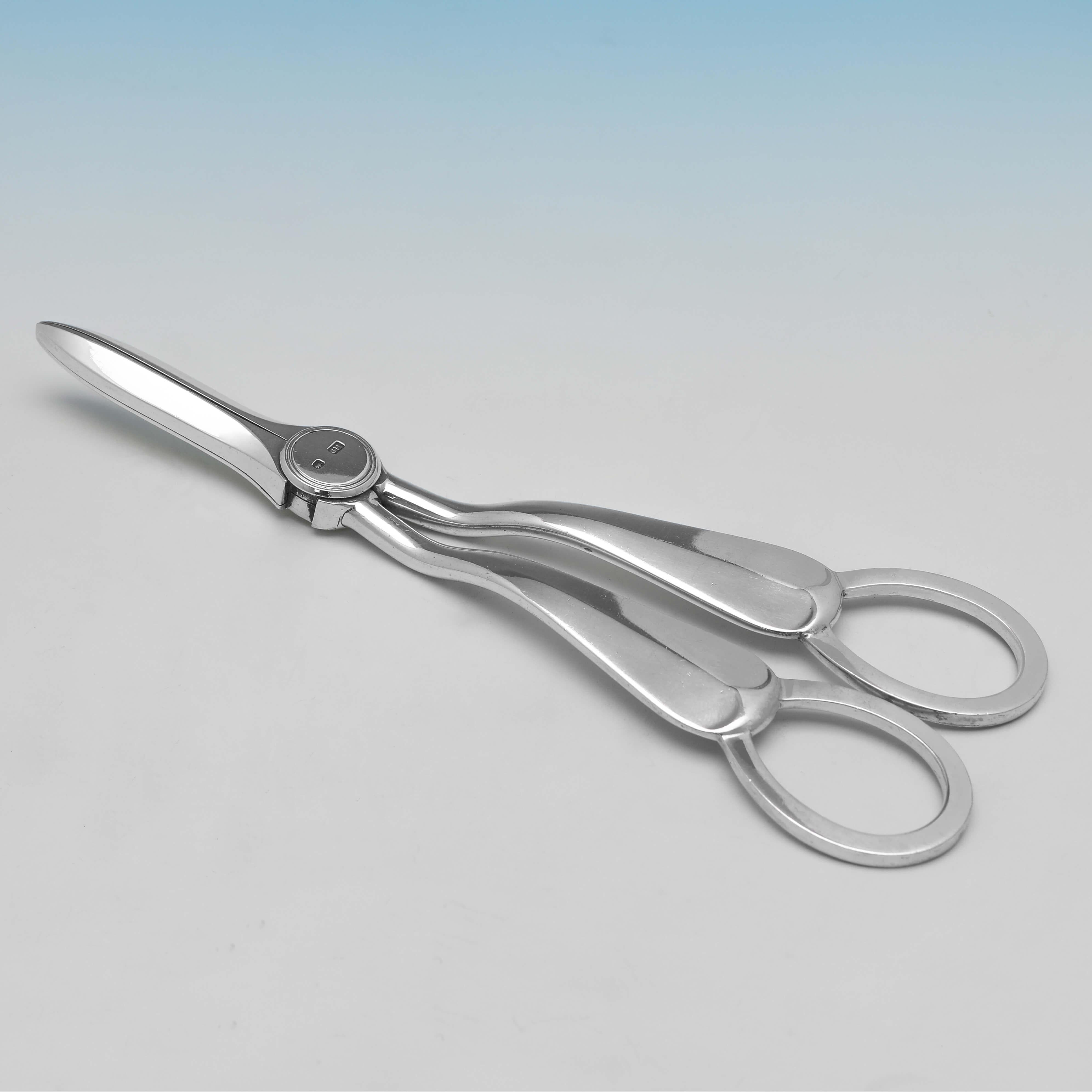 Hallmarked in Sheffield in 1911 by George Howson, this handsome pair of Antique Sterling Silver Grape Shears, are in 'Rattail' pattern, and are presented in their original box. 

The grape shears measures 6.25