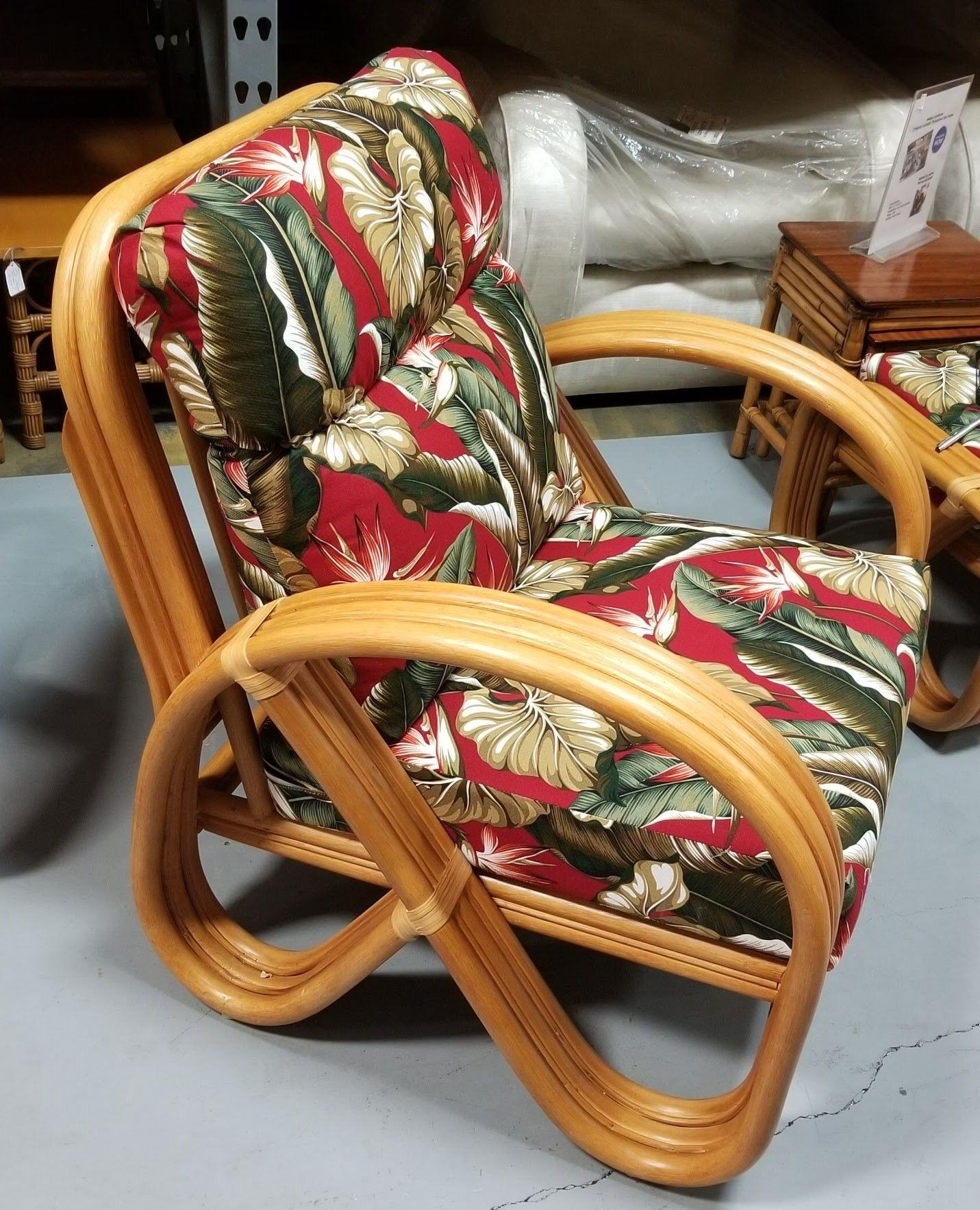 Restored rattan 3-Strand pretzel armchair with red and white birds of paradise tropical barckcloth cushions and a matching ottoman.

The 3-strand reverse pretzel rattan armchair is a unique and visually captivating piece of furniture adding a touch