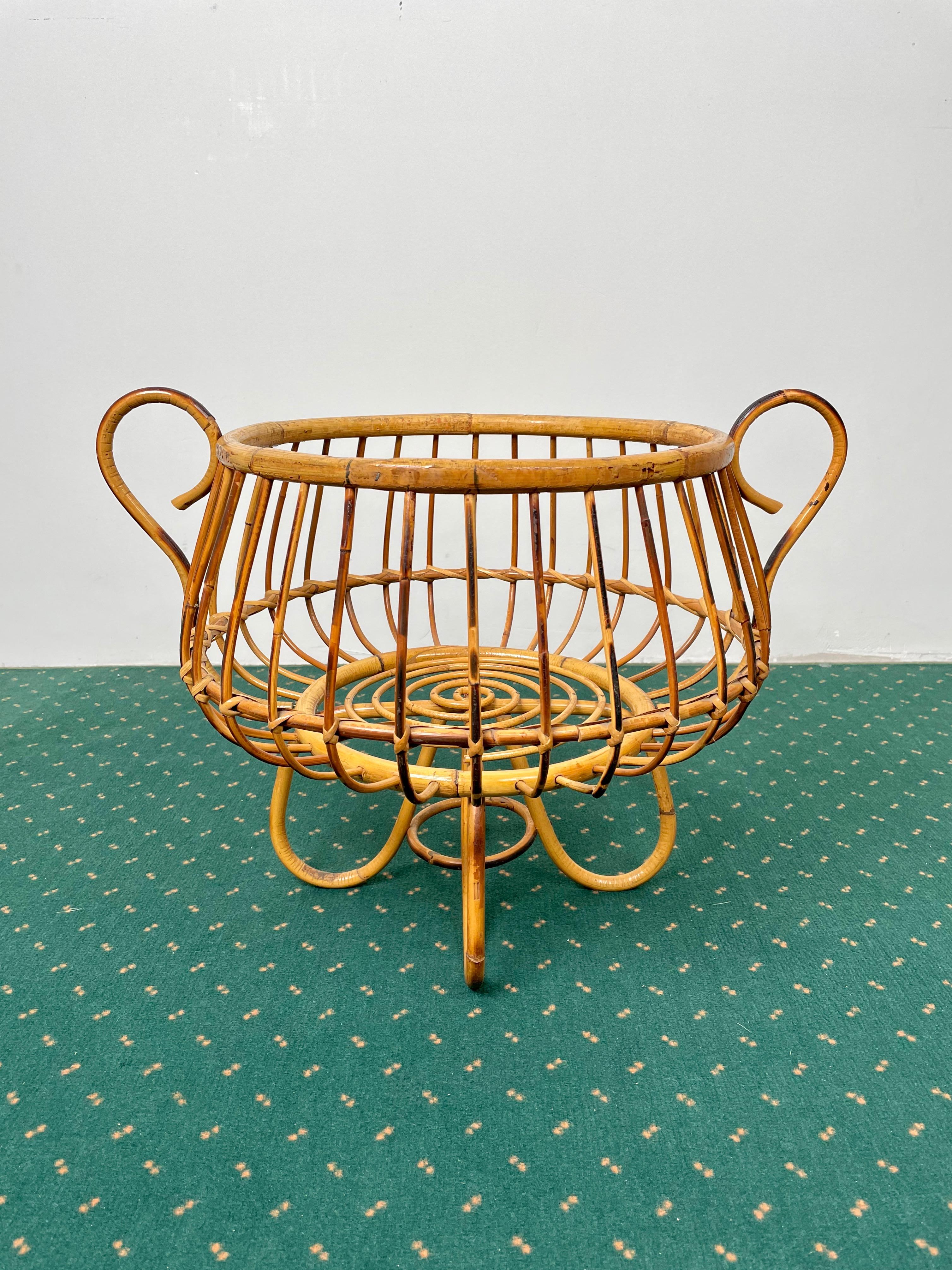 Lifted basket with handles in bamboo and rattan made in Italy in the 1960s.