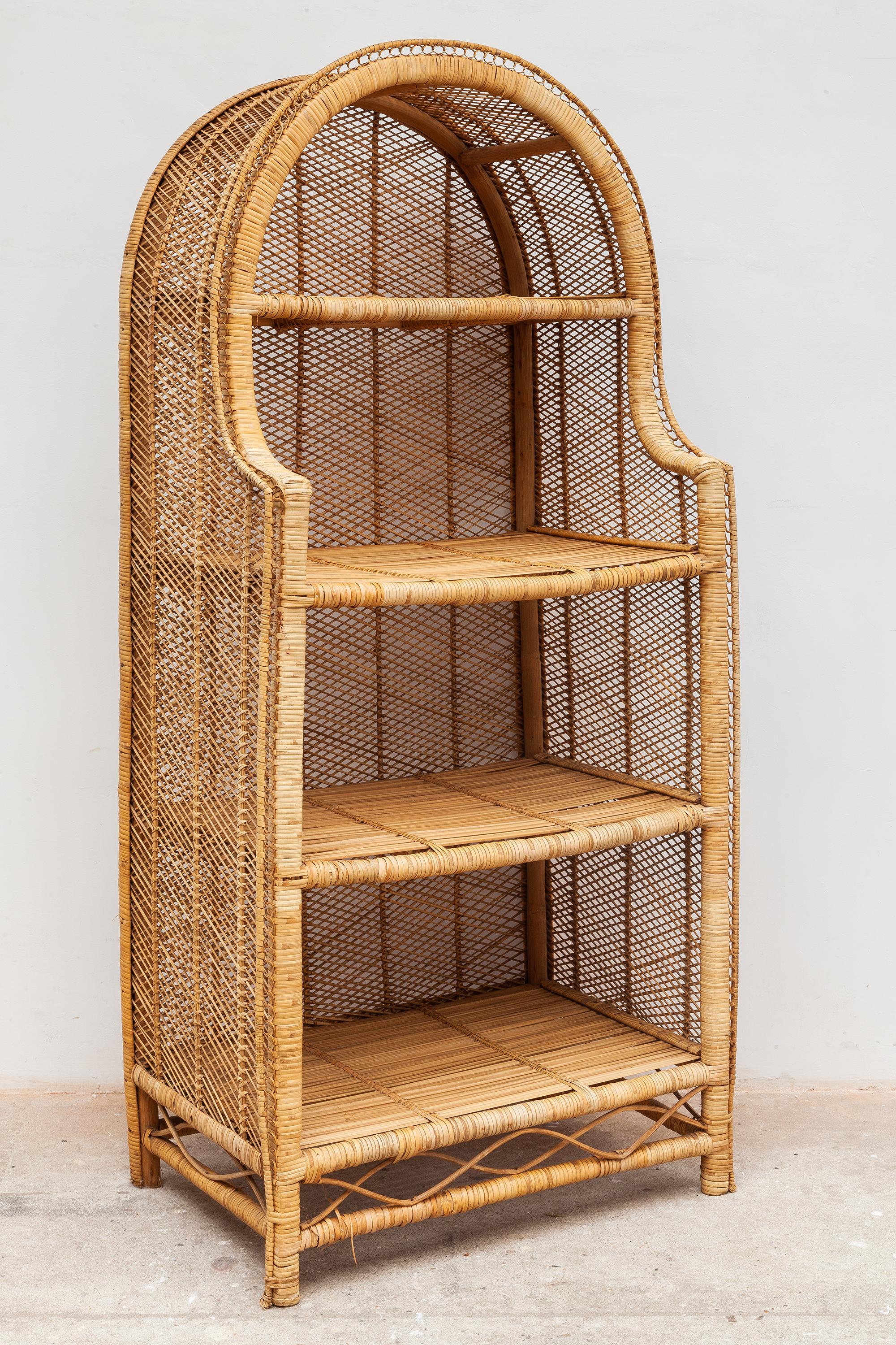 Vintage midcentury rattan shelf. Bamboo arch shaped frame with four shelves. Original model decoration or bookshelf perfect for adding some storage where you need in beautifully woven rattan which gives a special tropic accent in your