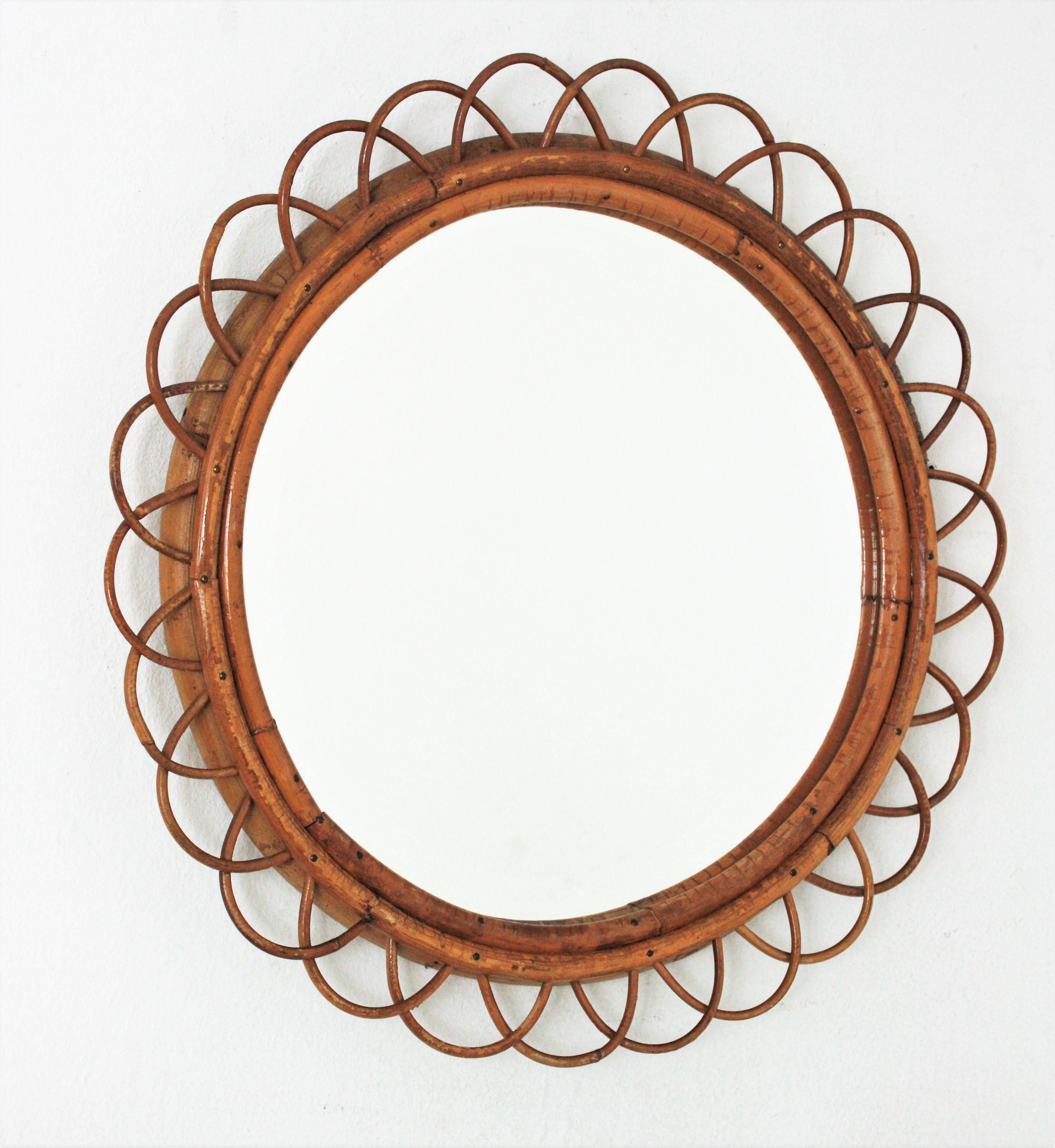 Round flower mirror, rattan, bamboo. Spain, 1960s
Eye-catching flower shaped bamboo and rattan mirror. 
Beautiful placed alone or as a part of a wall decoration with other cane mirrors. Interesting choice for a country house, beach house