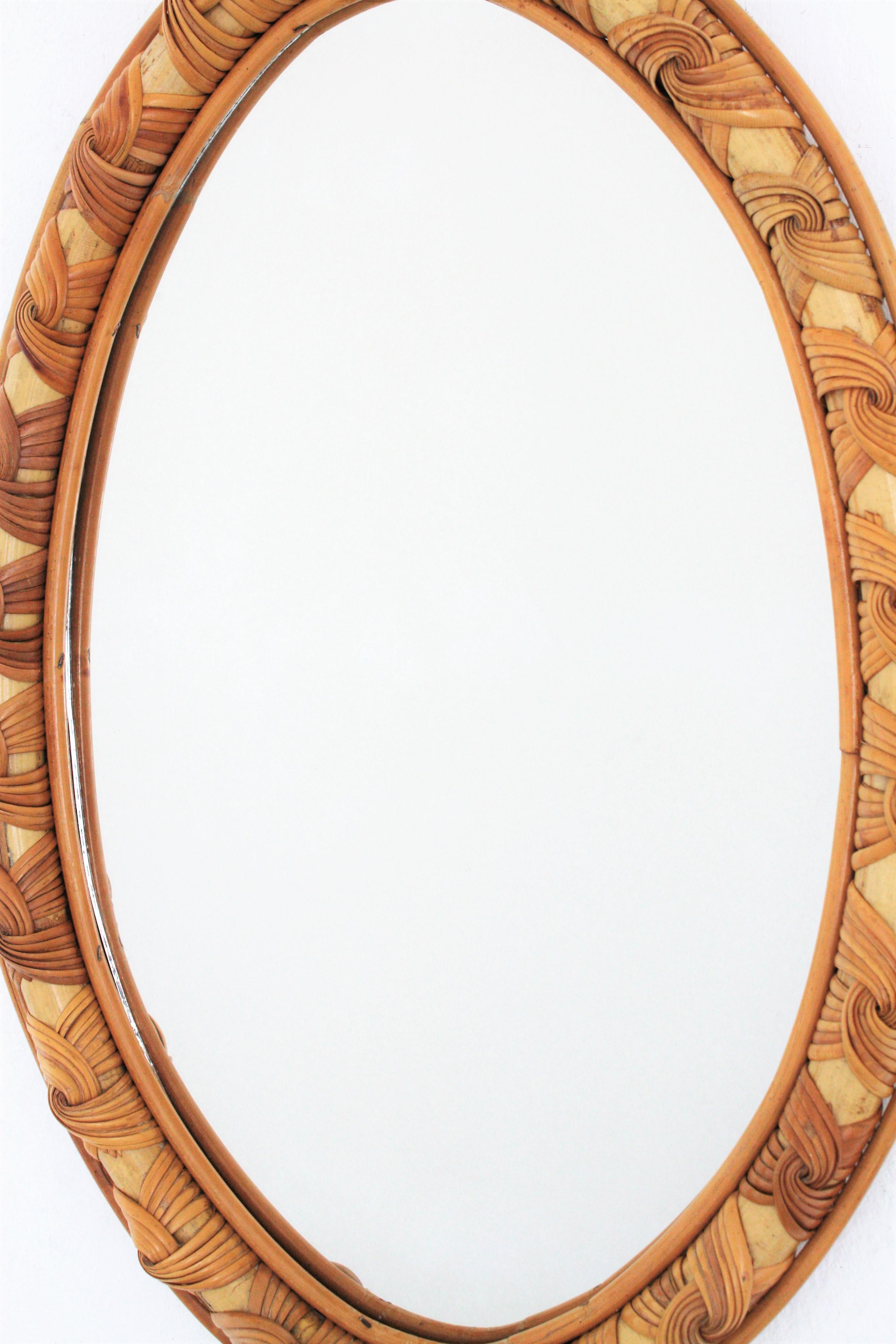 Hand-Crafted French Riviera Rattan Oval Mirror, Frame with Knot Details For Sale