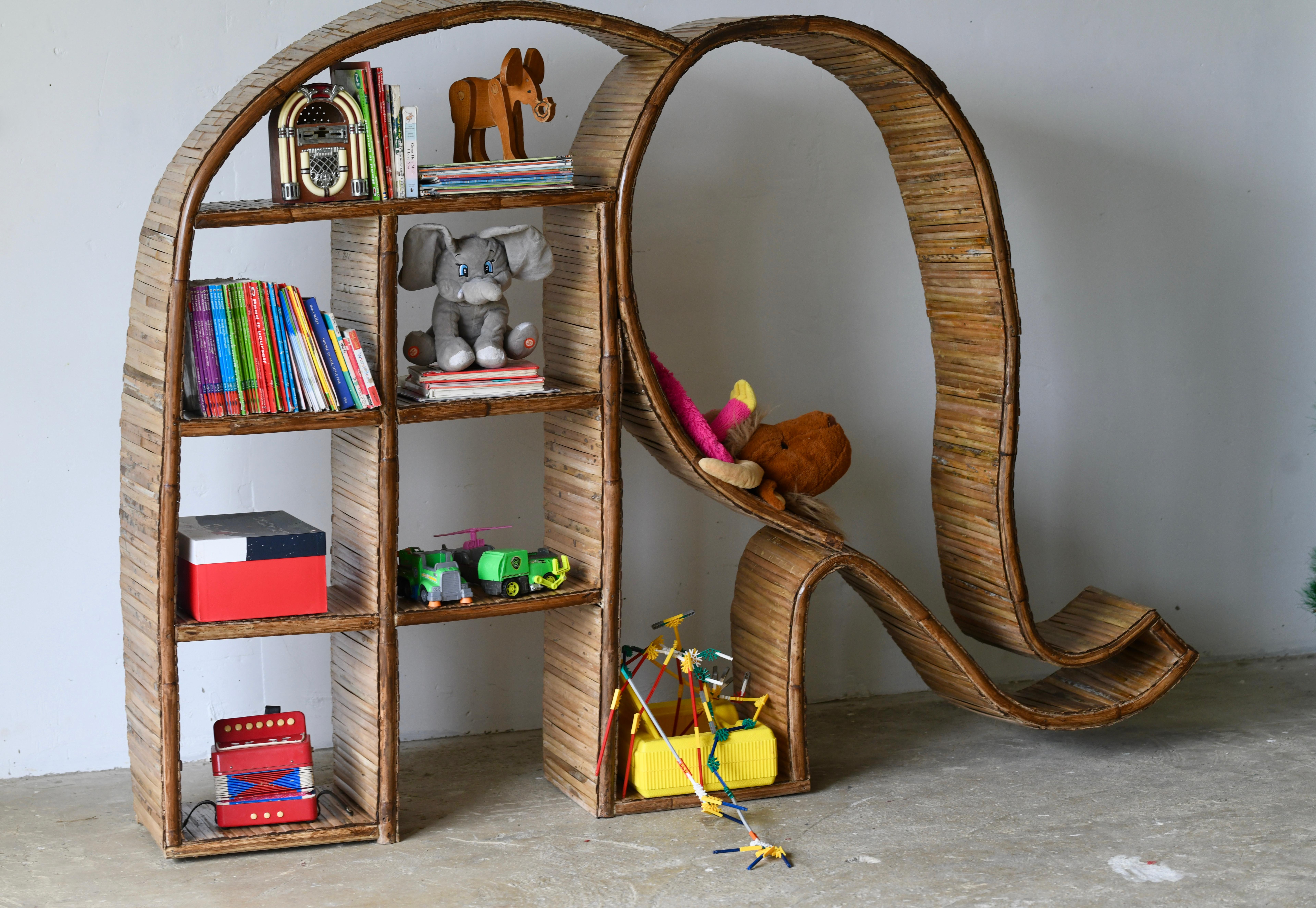 Theses organic bamboo shelving unit- bookcase, shaped like an elephant fabulous sculptural piece comprising of 8 shelves made from an organic rattan frame along with bamboo strips making up the shelving. Fabulous fun mid century feel great for the