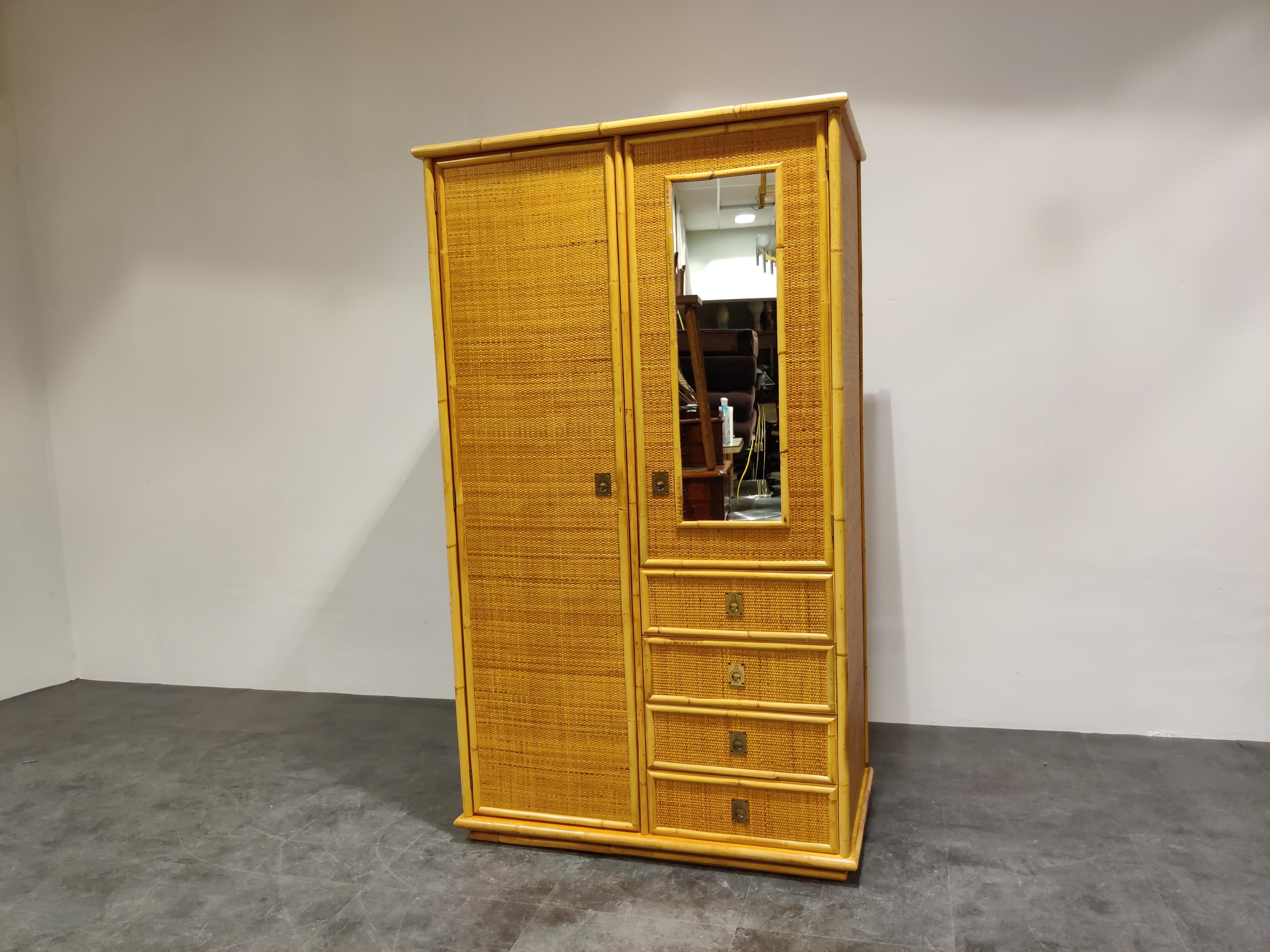 Very elegant mid century wardrobe manufactured by Dal Vera featuring 4 drawers and two doors, one with mirror.

Beautifully made, lovely brass handles and great vintage look.

Good condition, small damage to the floor on the inside of the