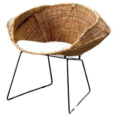 Rattan and bouclé easy chair