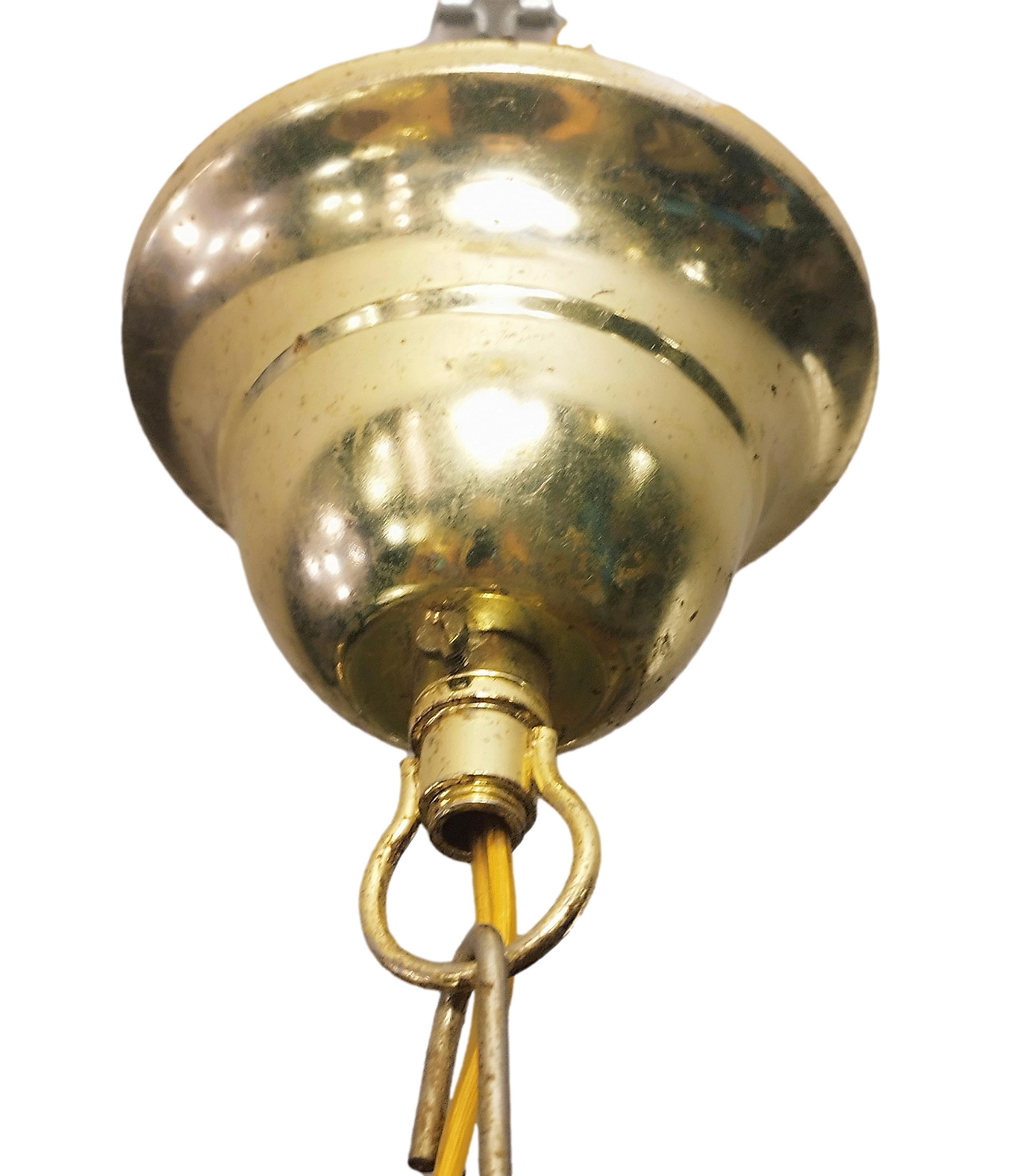 Beautiful cylindrical rattan pendant lamp from Italy, 1960s. Original rattan frame with a beautiful patina and paper shade.. It consists of a chandelier shade resembling a round rattan cage and a chain with brass cups.