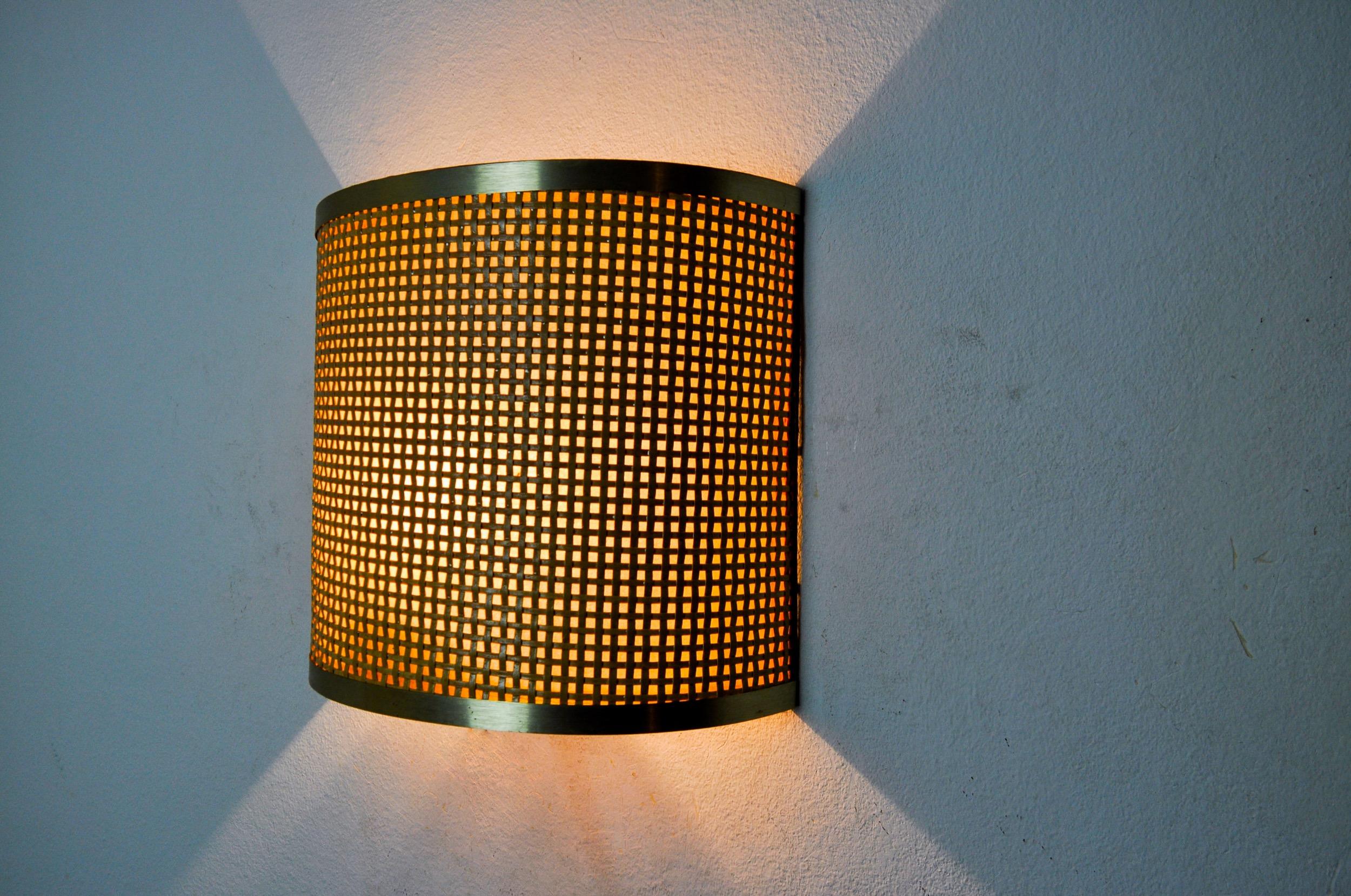 Very beautiful and rare rattan and brass wall lamp designated and produced in italy in the 1960s. A classic design that will illuminate your interior perfectly. Verified electricity, time mark consistent with the age of the object. Unique design