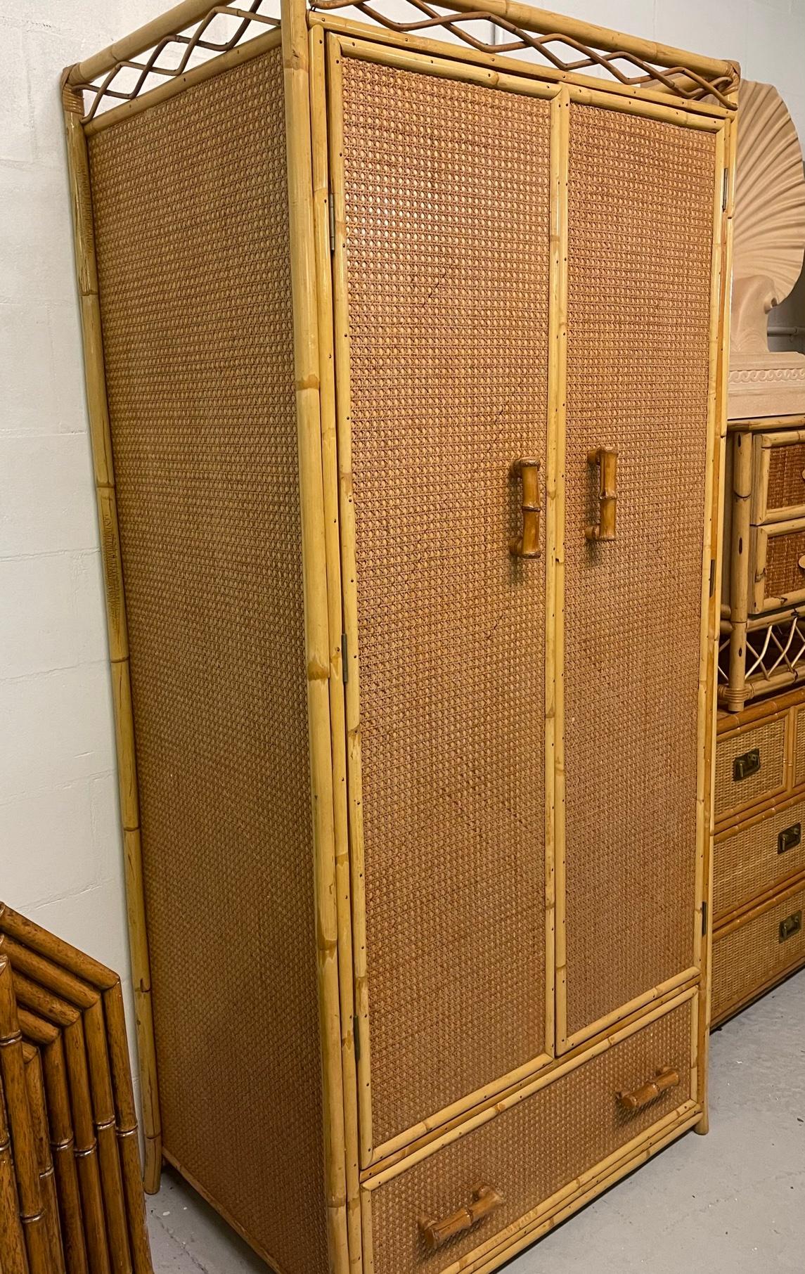 Large wardrobe features a cane veneer and rattan/faux bamboo detailing. Brought to the US from England, originally purchased from Angrave's in Leicester. Very good condition with minor imperfections consistent with age.