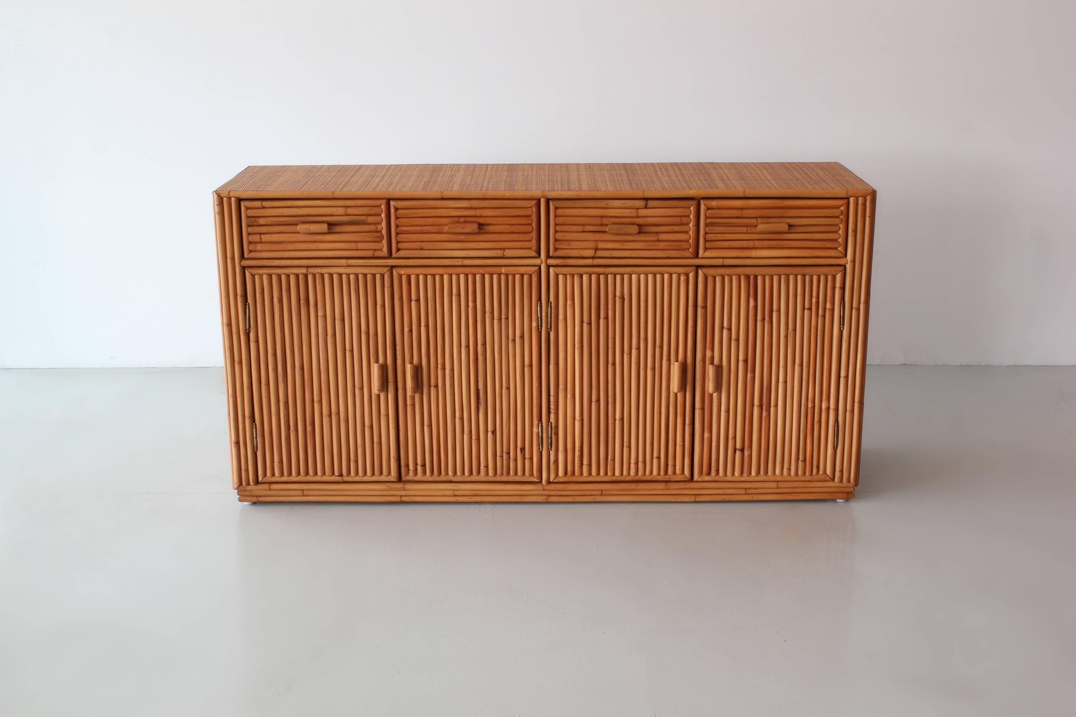 Rattan cabinet wonderfully constructed with four drawers and open shelving.