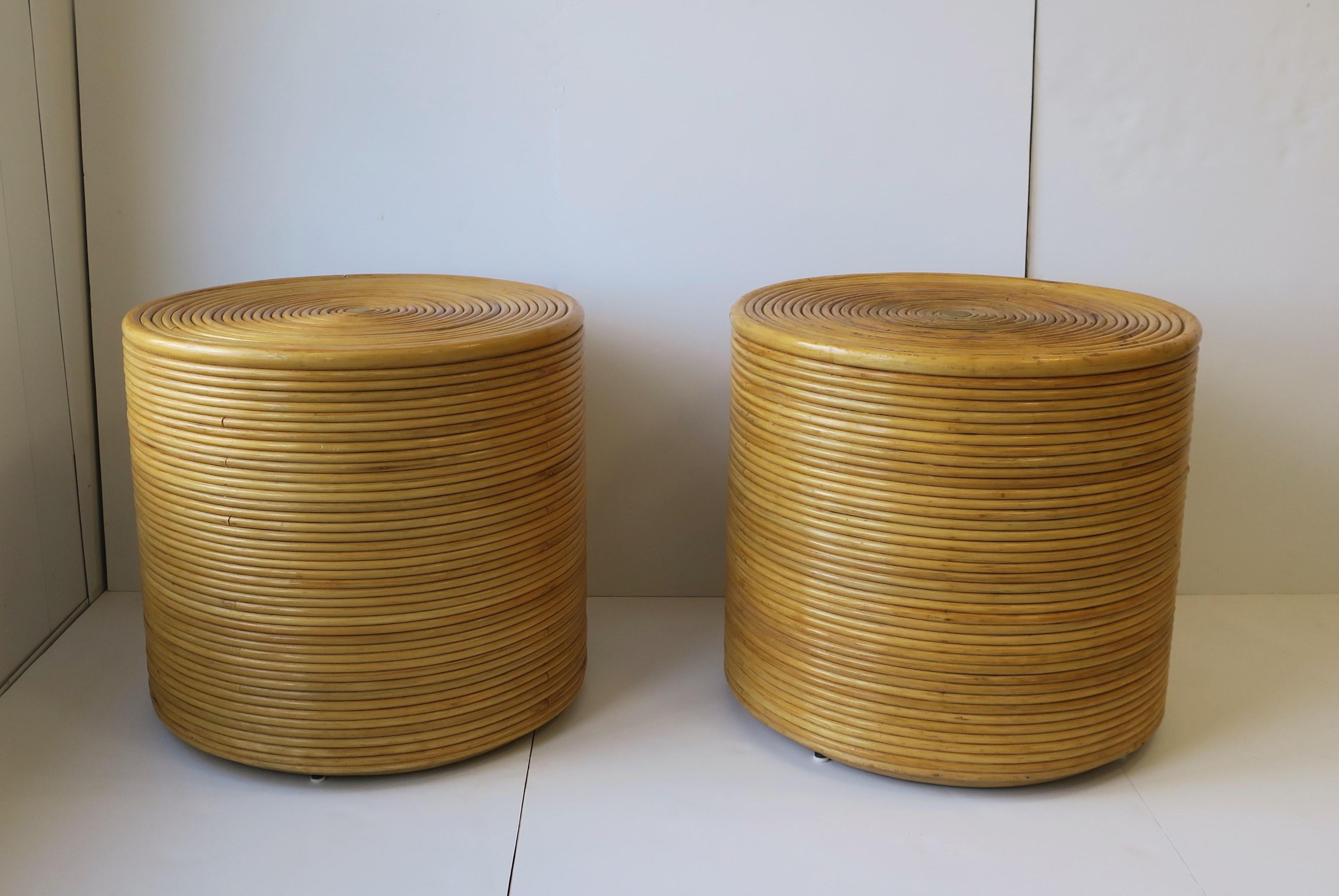 A great pair of bent rattan end tables with smoked glass tops, in the style of McGuire furniture, circa late-20th century. These round tables can be used with or without smoked glass tops as shown in images. 

Dimensions: 24.25
