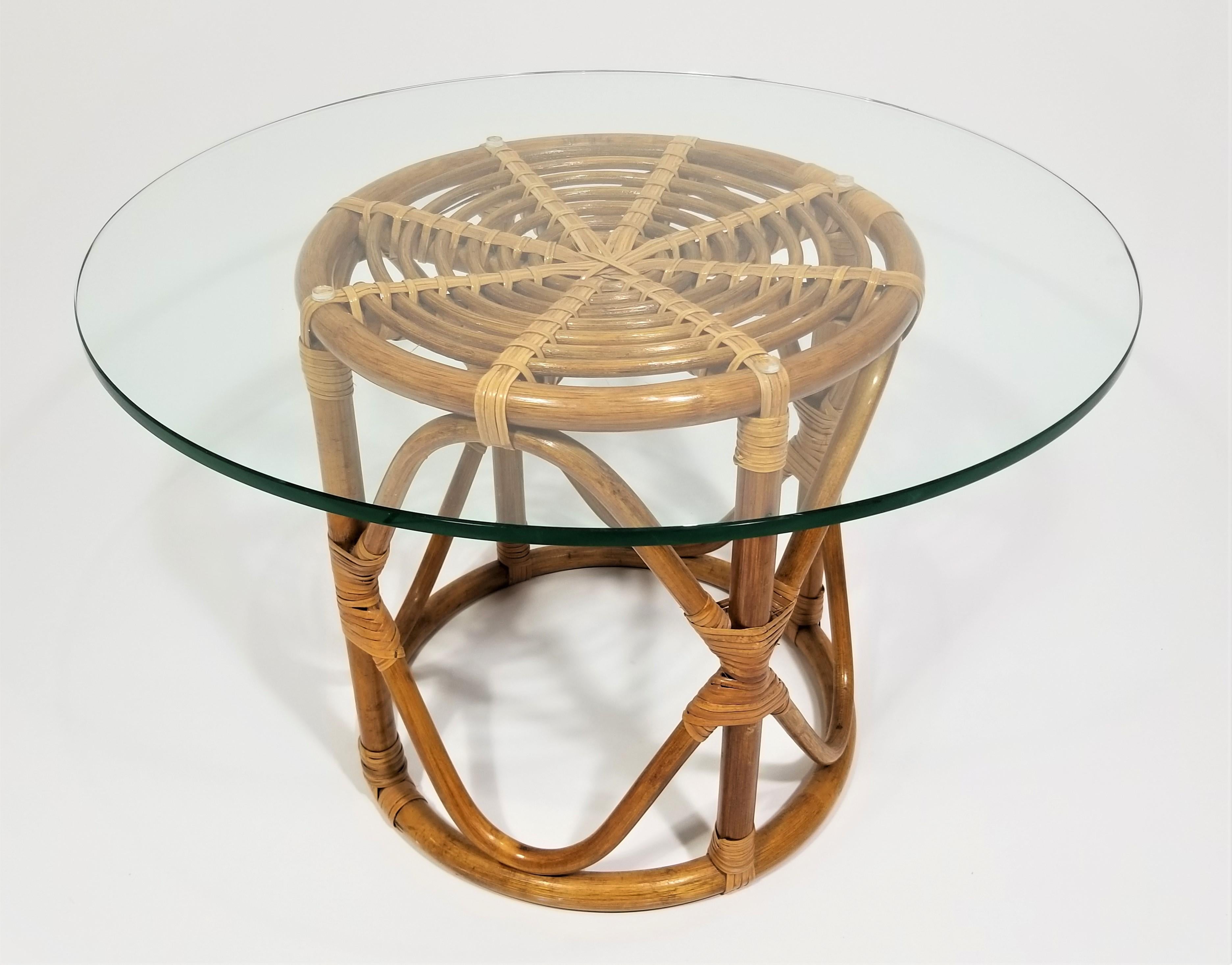 Mid century 1970s rattan and glass top table. End table, side table or could also be used as a coffee or cocktail table. 

Complimentary free delivery can be arranged for this item in NYC and surrounding areas. 

Wicker base dimensions 
Height: