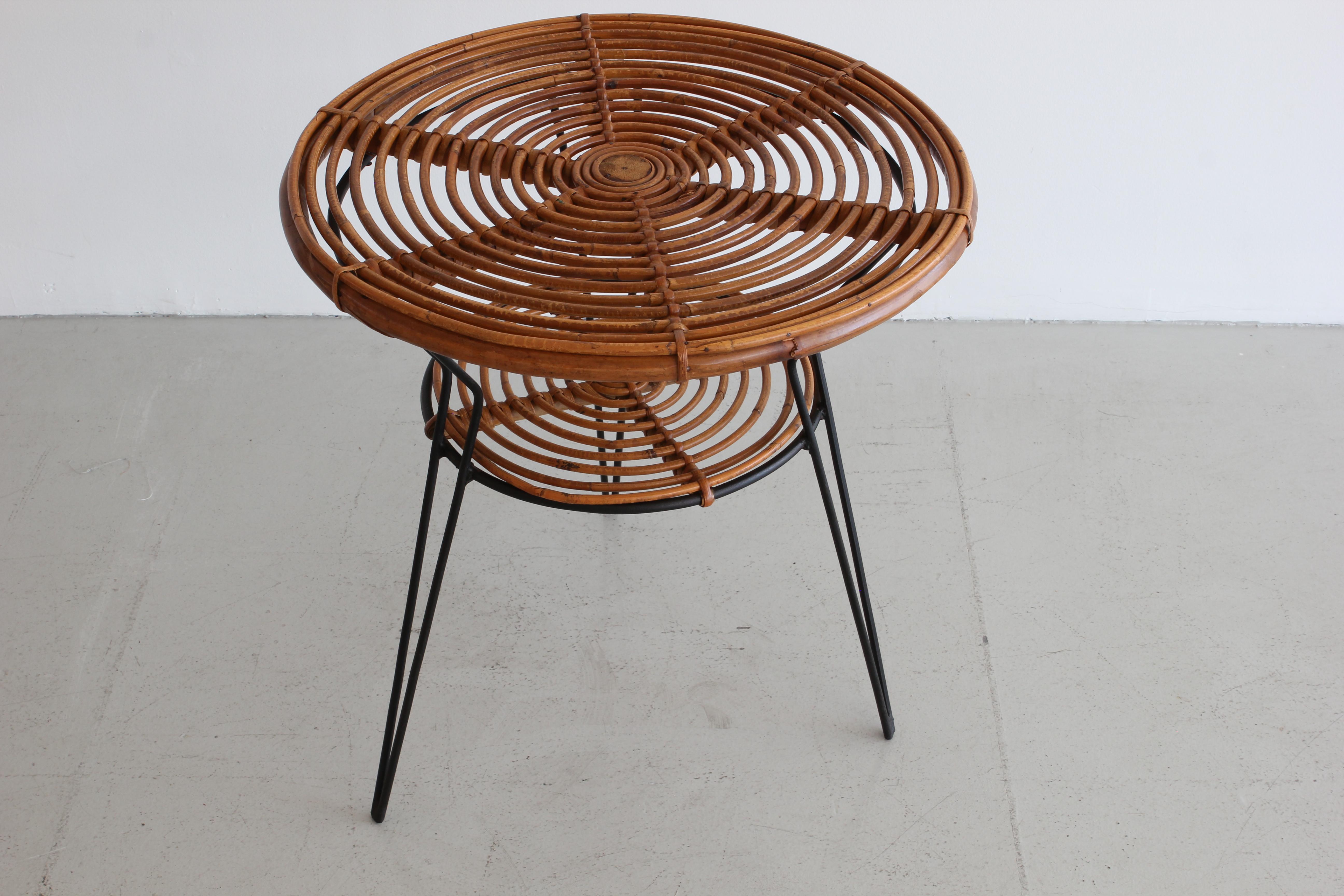 Italian two tiered table with hairpin tripod legs. 
Italy, circa 1960.