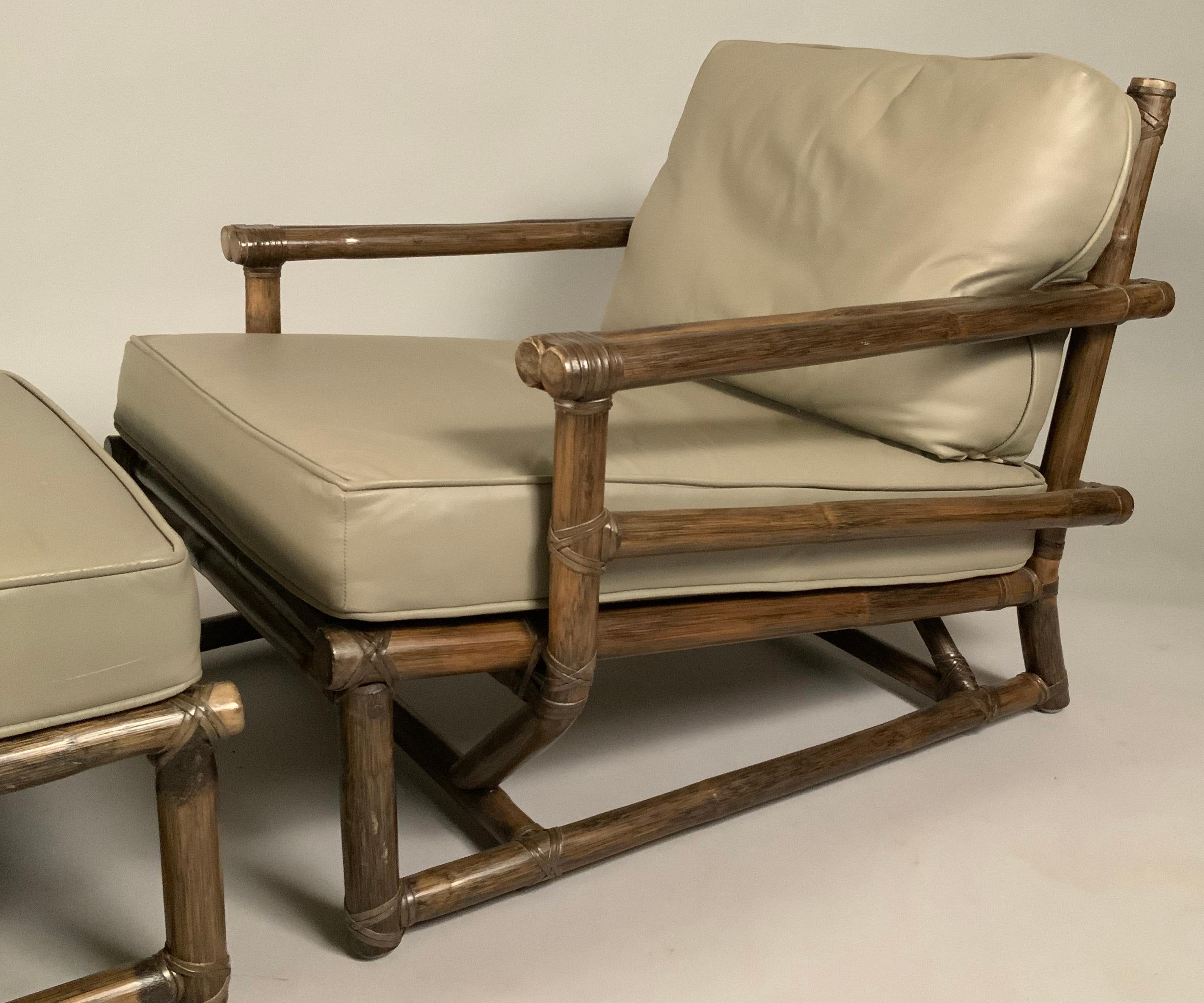A beautiful large scale rattan frame lounge chair and matching ottoman by Mcguire. The frame made from rattan and lacing, and the cushions upholstered in greige leather. The frames and the leather cushions are in excellent condition.

Ottoman