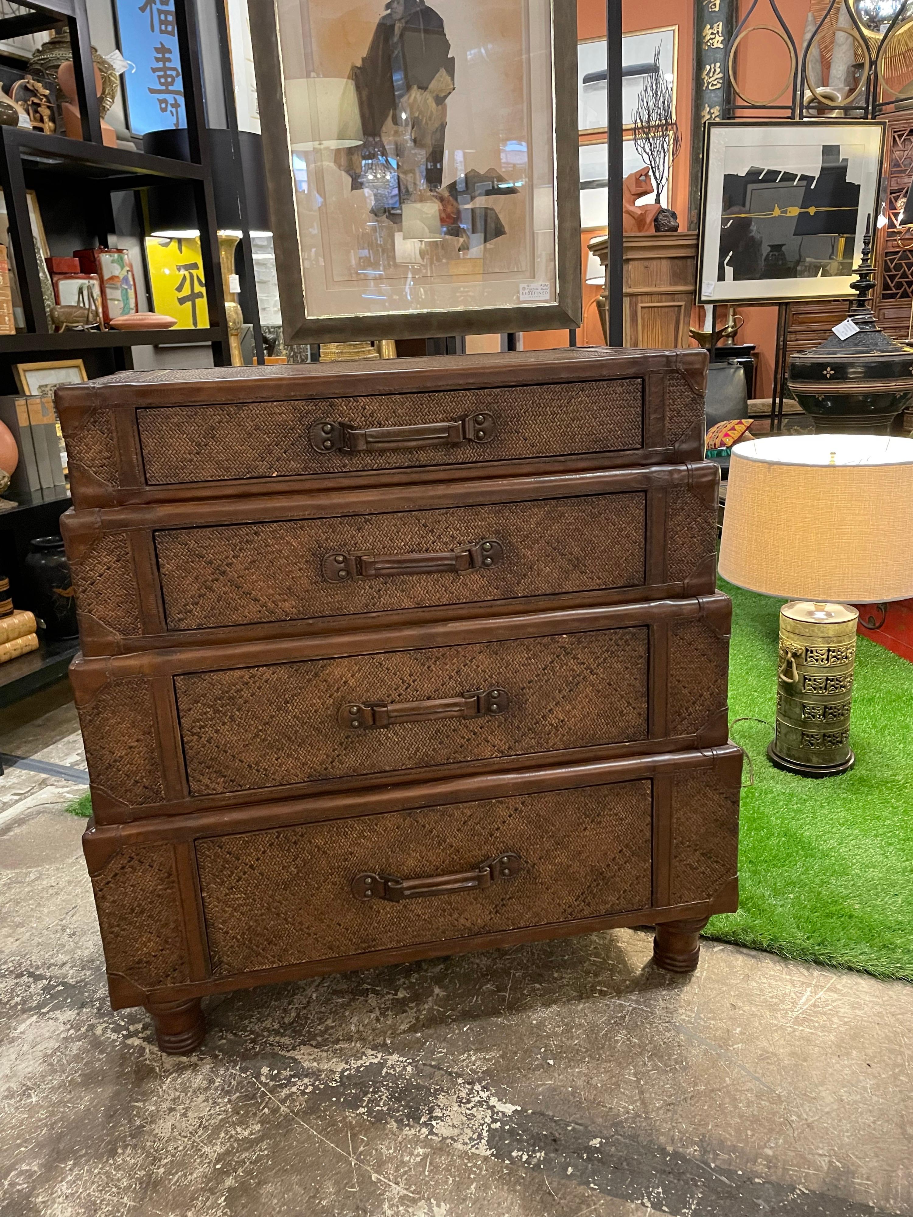 This is a great four drawer dresser made of rattan and leather probably from the 1990s and looks like a Maitland Smith piece but no markings