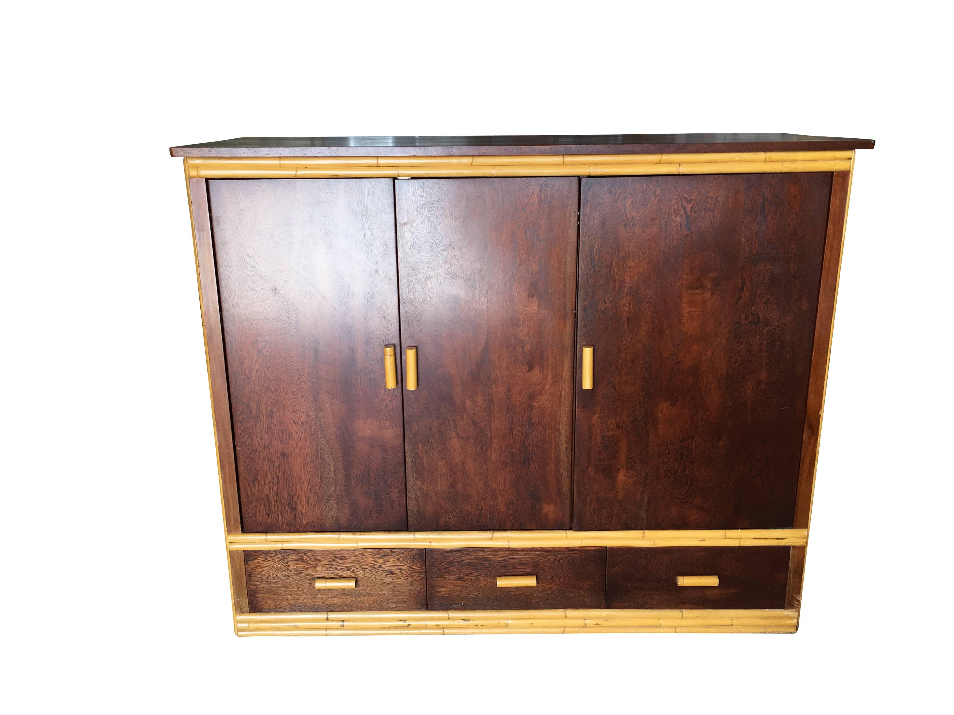 Large rattan and mahogany TV cabinet made with hide away sliding doors, storage drawers, and adjustable component shelves. This Cabinet opens with a middle TV shelf and additional side component rack with six adjustable shelves for a Roku, DVD,