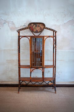 Estantería de ratán y junco con puerta de cristal biselado – Dal Vera – 1910