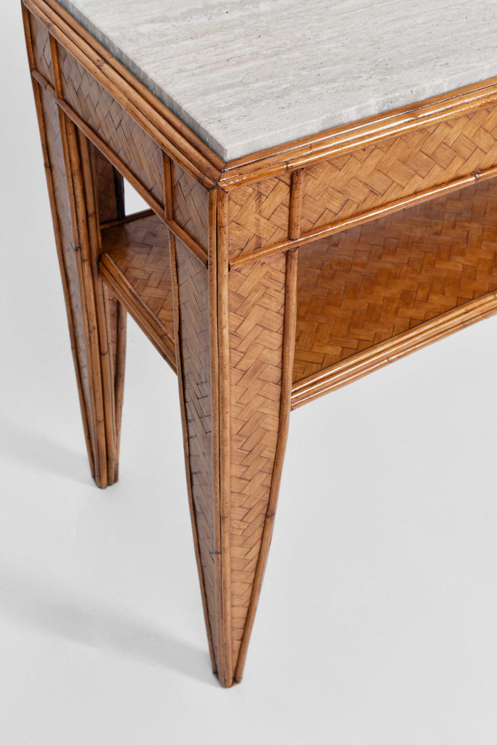 Rattan console table in tapered sheath legs joined by a spacer shelf, travertine table top. Italy, 1960s.