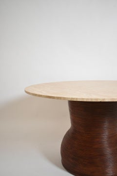 Rattan and travertine round dining table, 1970s.
