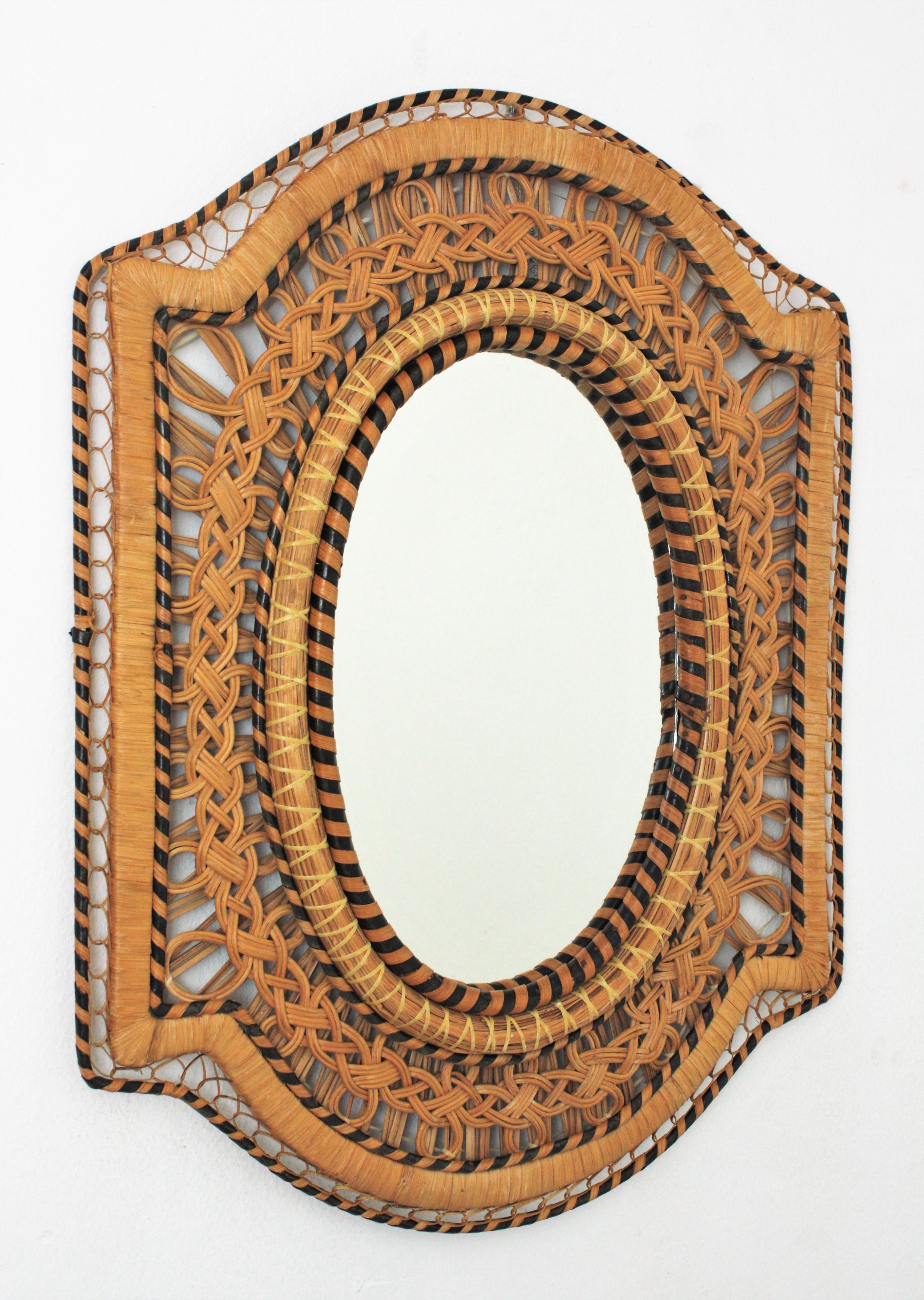 Peacock woven wicker rattan midcentury mirror, Spain 1970s
This eye-catching mirror is framed by a handwoven wicker intrincate and natural fibers combining different colors and creating a beautiful visual effect.
It show an excellent handcrafted