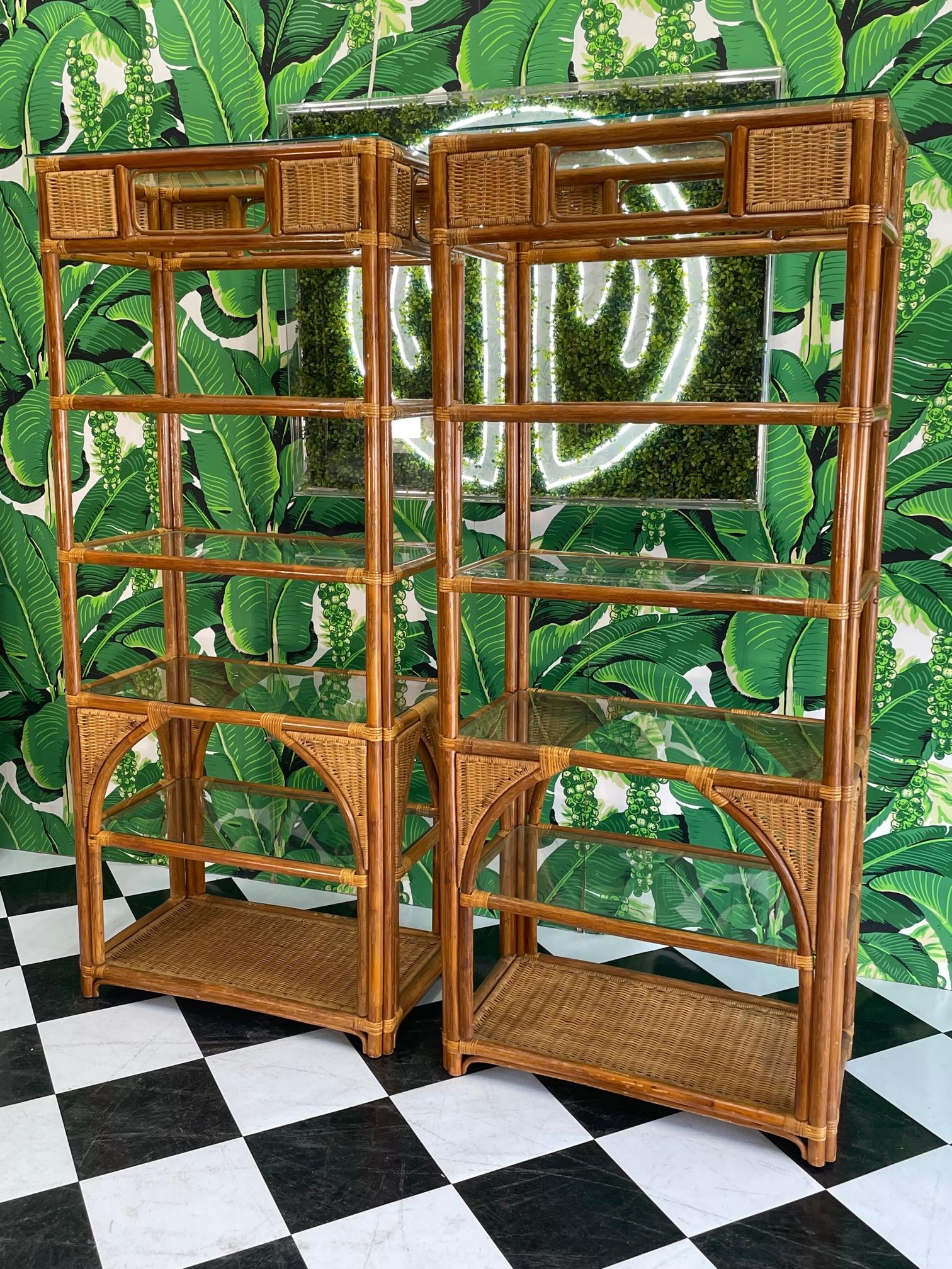 Pair of vintage etageres feature full rattan construction and wicker detailing with glass shelving. Good condition with minor imperfections consistent with age, see photos for condition details.
For a shipping quote to your exact zip code, please