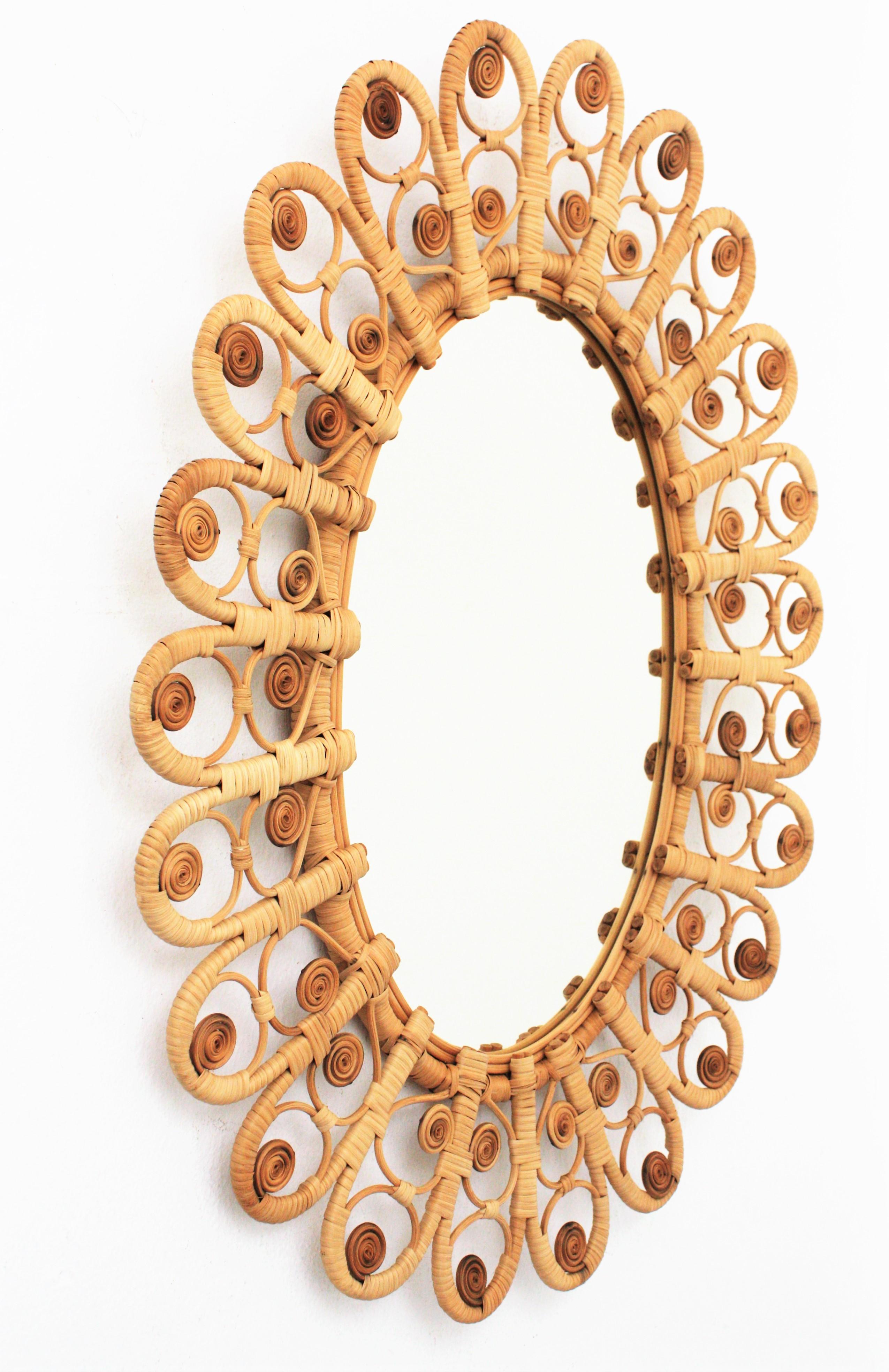 Rattan and Wicker Large Oval Mirror with Filigree Peacock Frame, Spain, 1960s In Excellent Condition In Barcelona, ES