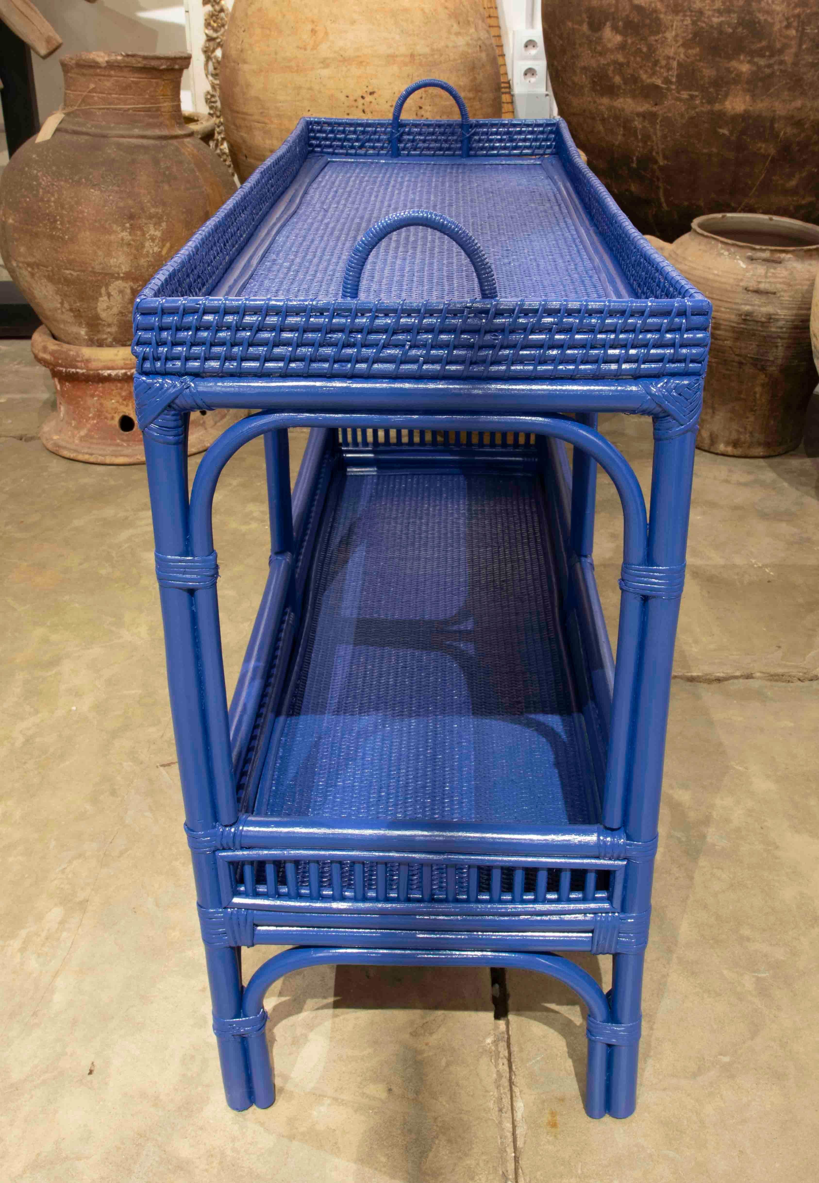 20th Century Rattan and Wicker Shelving Unit with Two Bar Shelves Painted in Blue