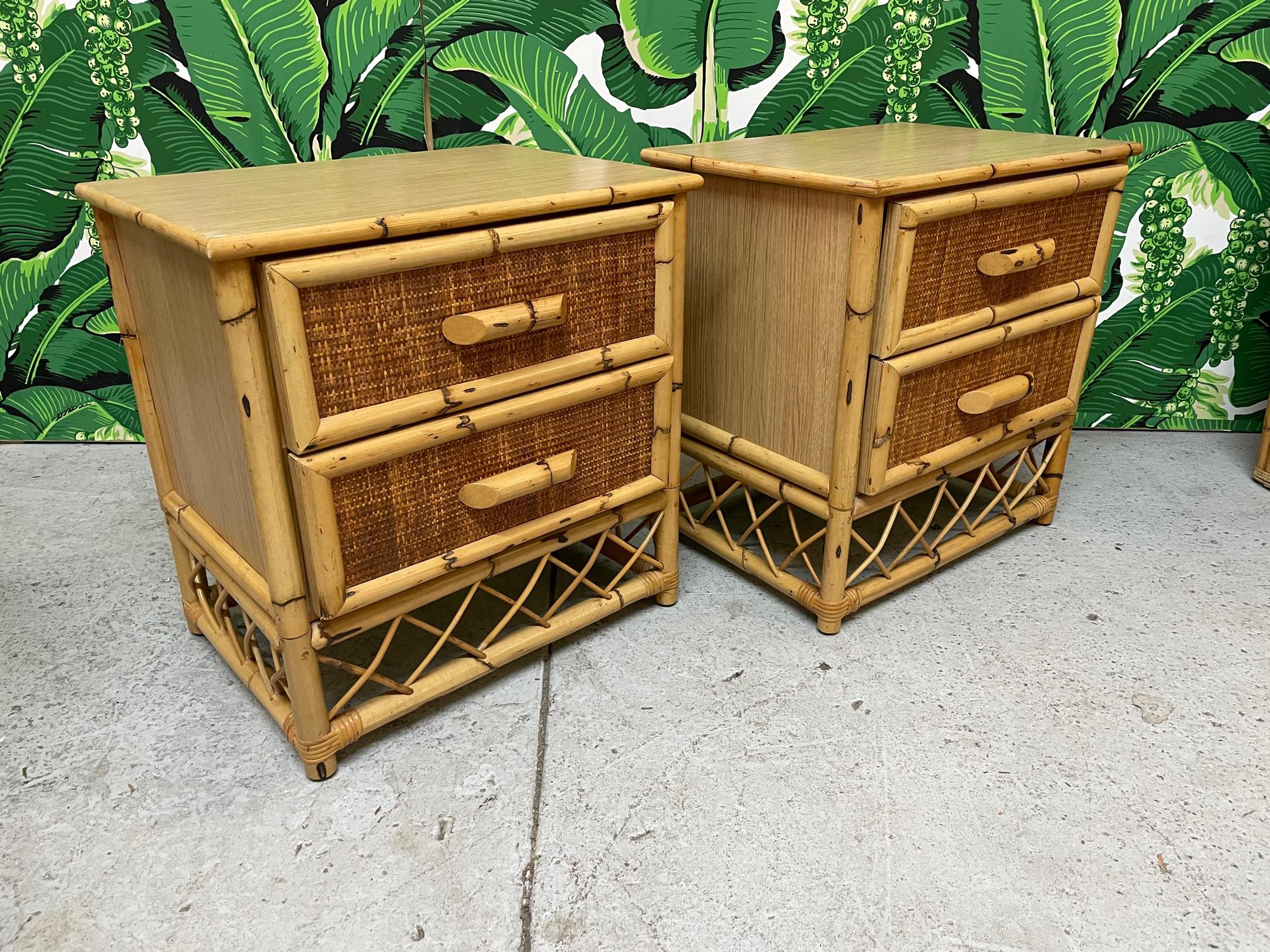 Vintage rattan nightstands feature woven wicker drawer fronts and fretwork skirts. Good condition with imperfections consistent with age, see photos for condition details. 
For a shipping quote to your exact zip code, please message us.
