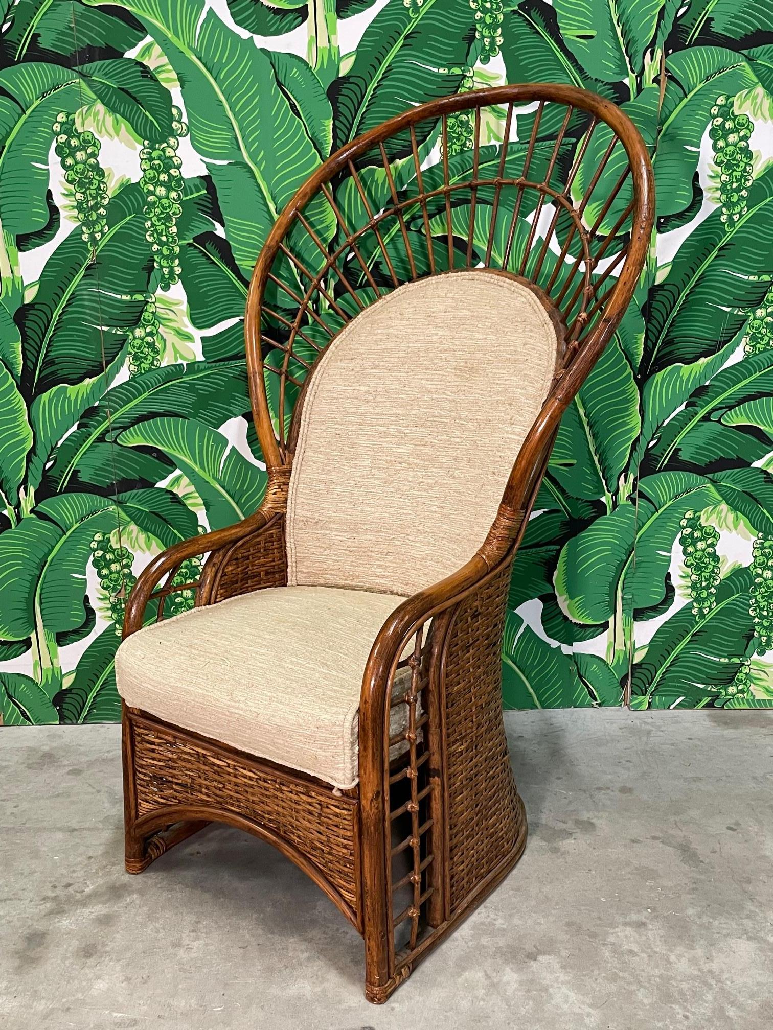 Rattan and wicker peacock chair features upholstered seat and back and a rich, dark brown finish. Full rattan construction. Good condition with imperfections consistent with age, see photos for details.
For a shipping quote to your exact zip code,