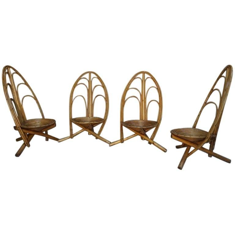 Quatre fauteuils de salon et d'extérieur en rotin et bois en vente
