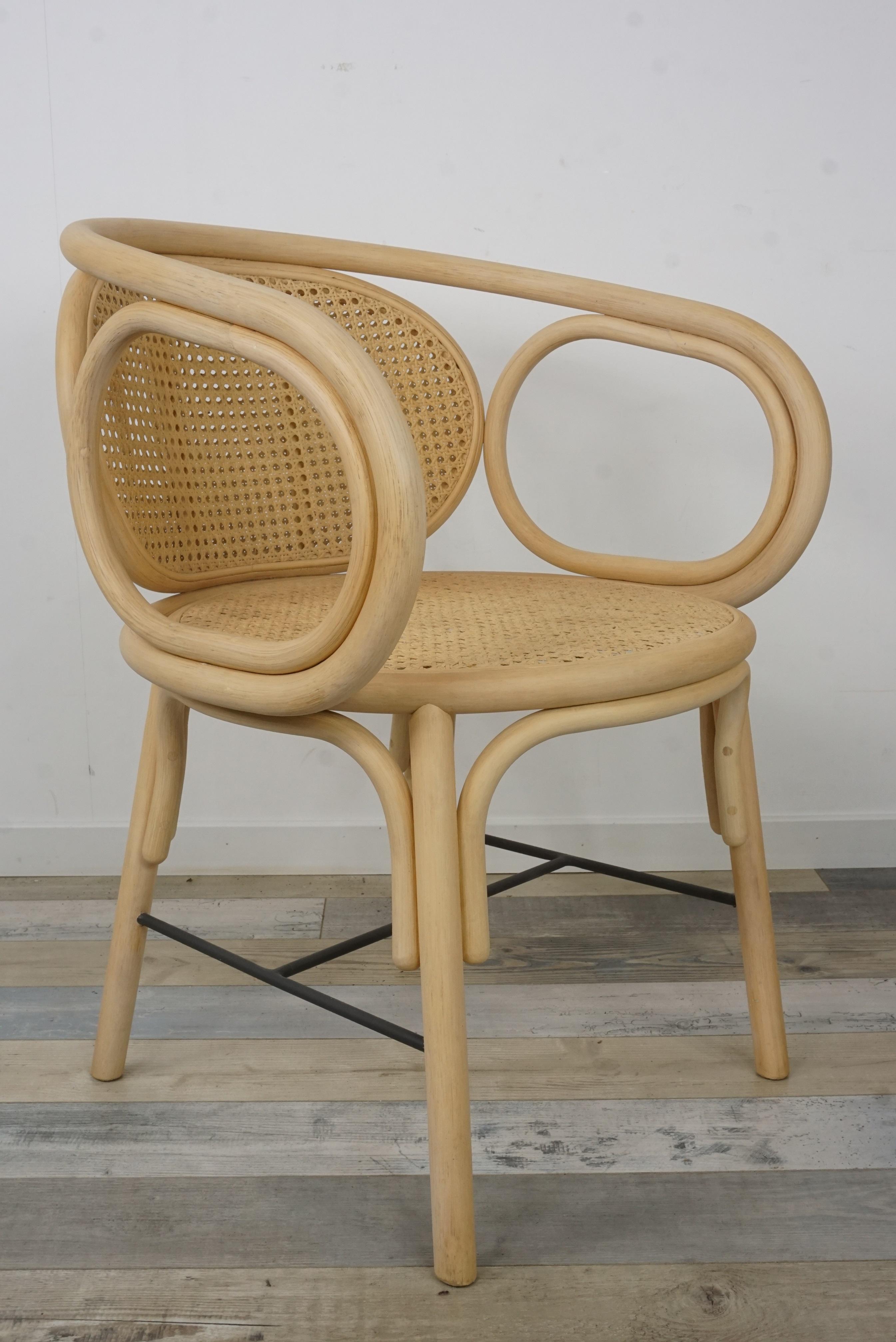 Rattan and woven cane armchair French modern design combining modernity and tradition, design lines, graphic and timelessness this armchair is composed of a robust rattan and airy structure, woven cane and back adorned with a comfy mustard