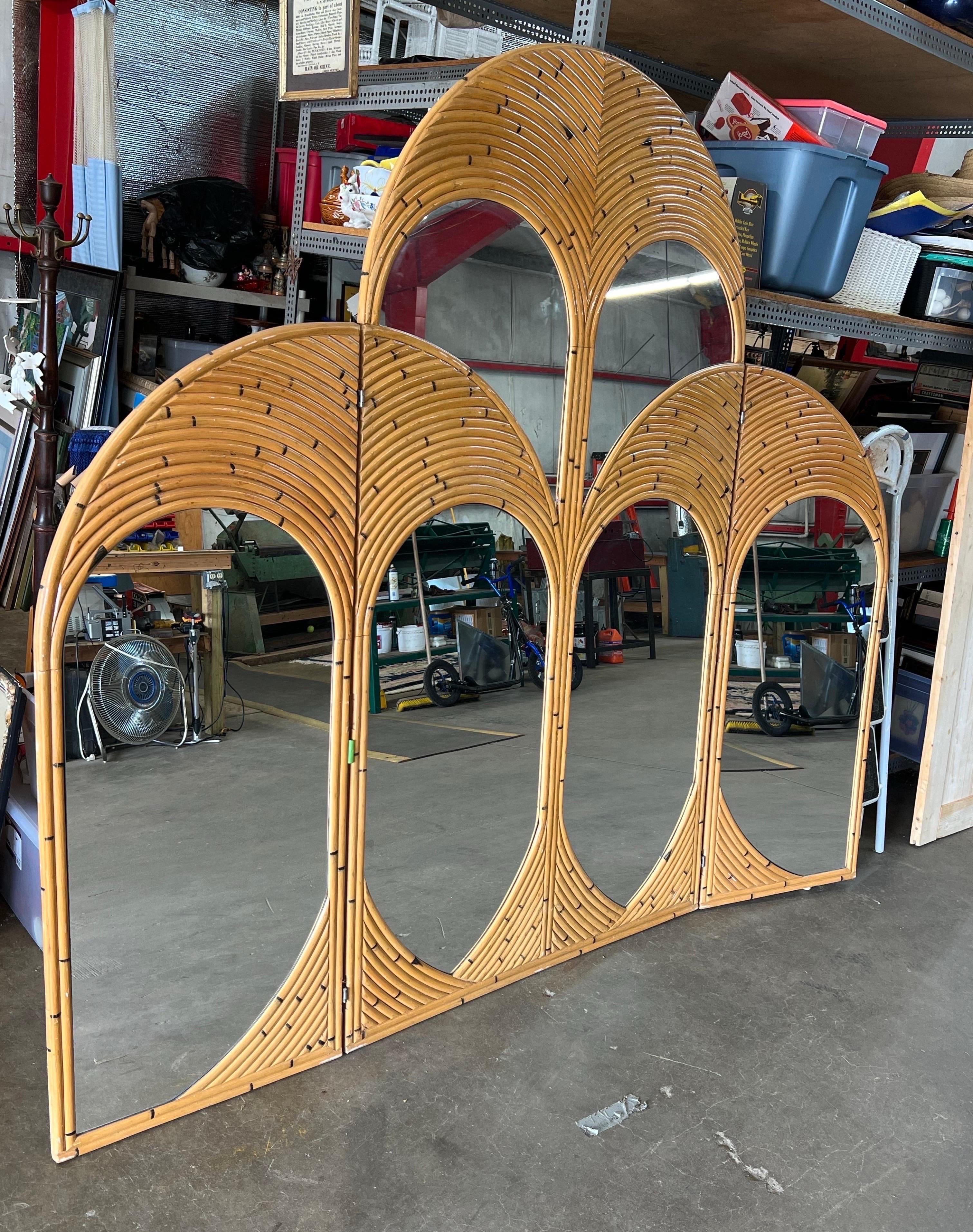 Rattan Arched Mirror Room Divider, 1970

Gorgeous one of a kind rattan mirrored room divider from the 1970s

Massive size with 7 feet tallest for the center and 5 feet tall for the side (left and right) panels