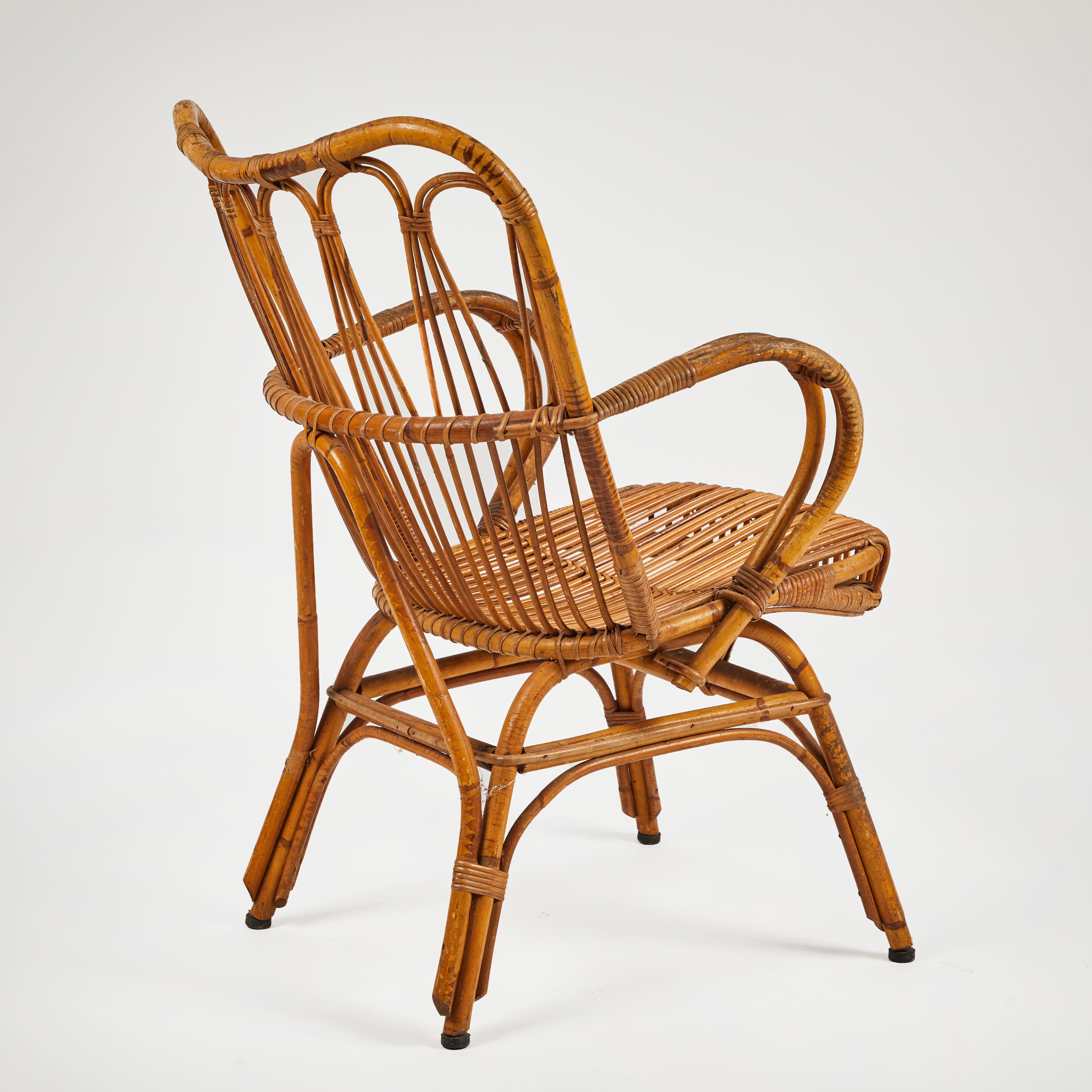 A rattan armchair dating from 1960s France. Stable, Sturdy and Decorative.