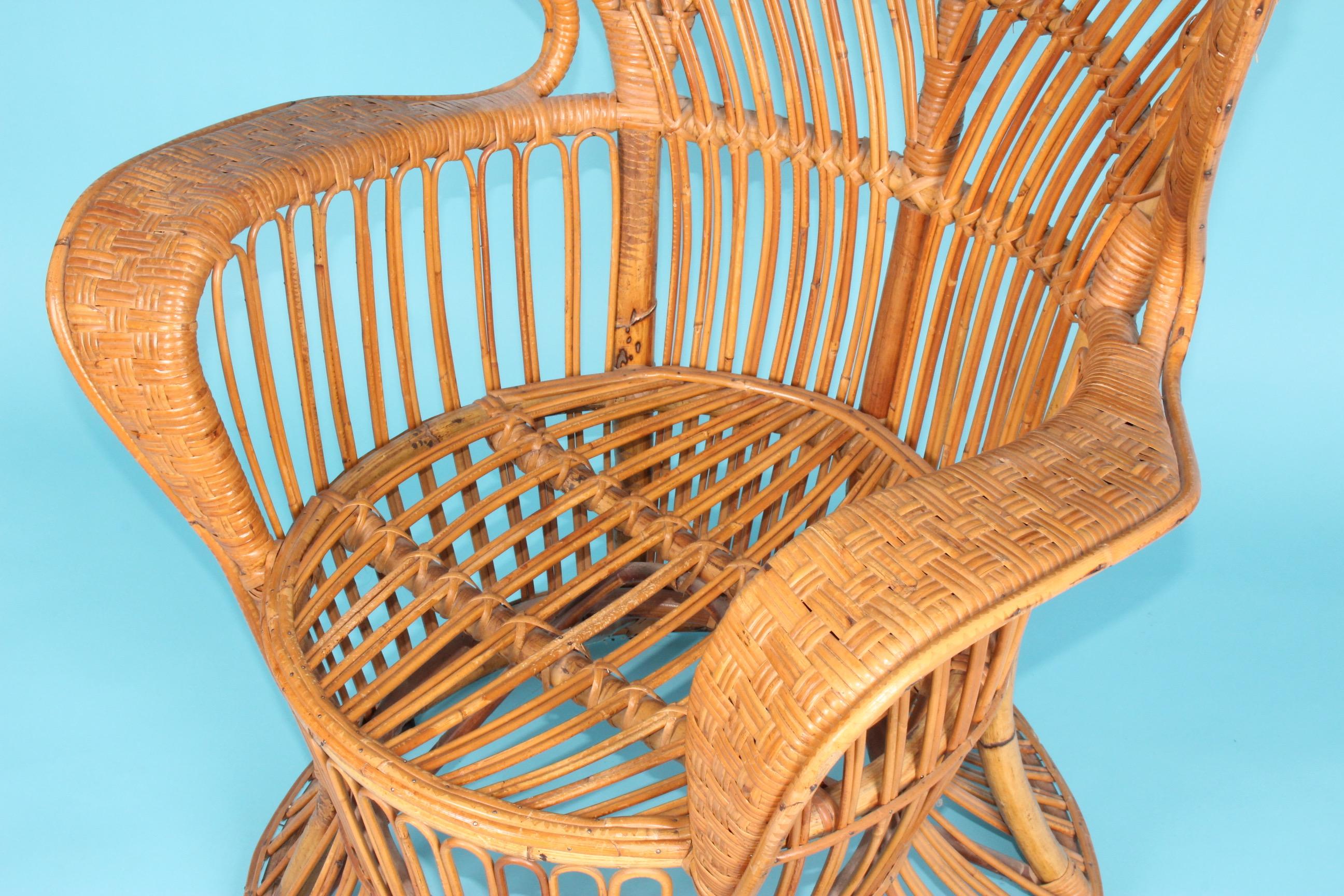 Rattan armchair designed by Lio Carminati, small damage on the top back side see photo.