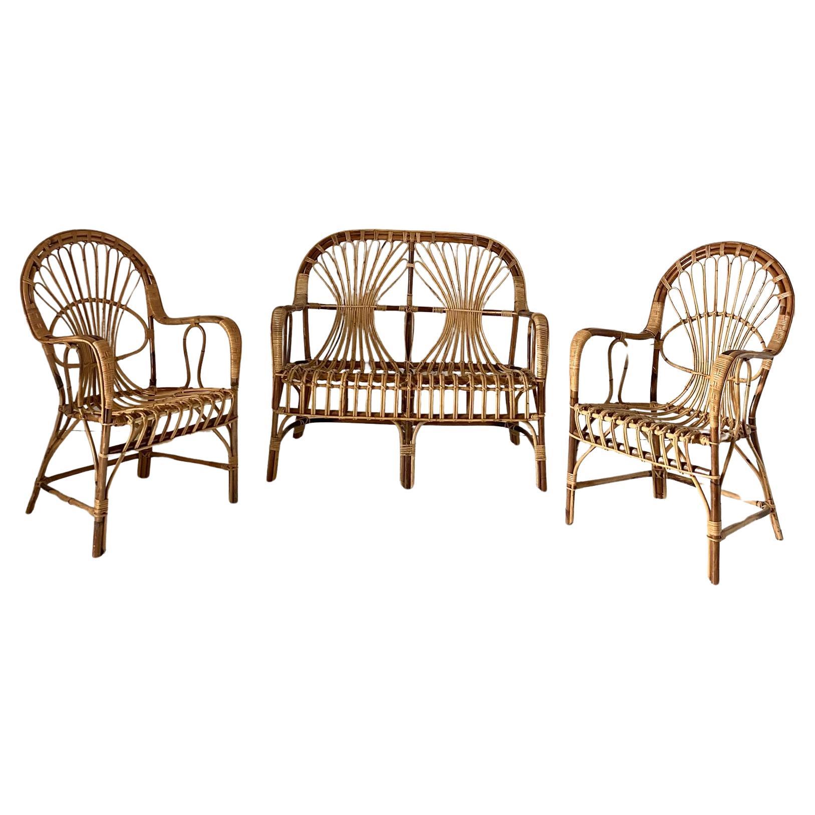 A beautiful 1960's attributed to Franco Albini style,Mid-century rattan and curved bamboo Italian set composed by a two seats sofa and two armchairs.  Finely hand made manufactured items, made with rattan and curved bamboo. Iconic italian piece of