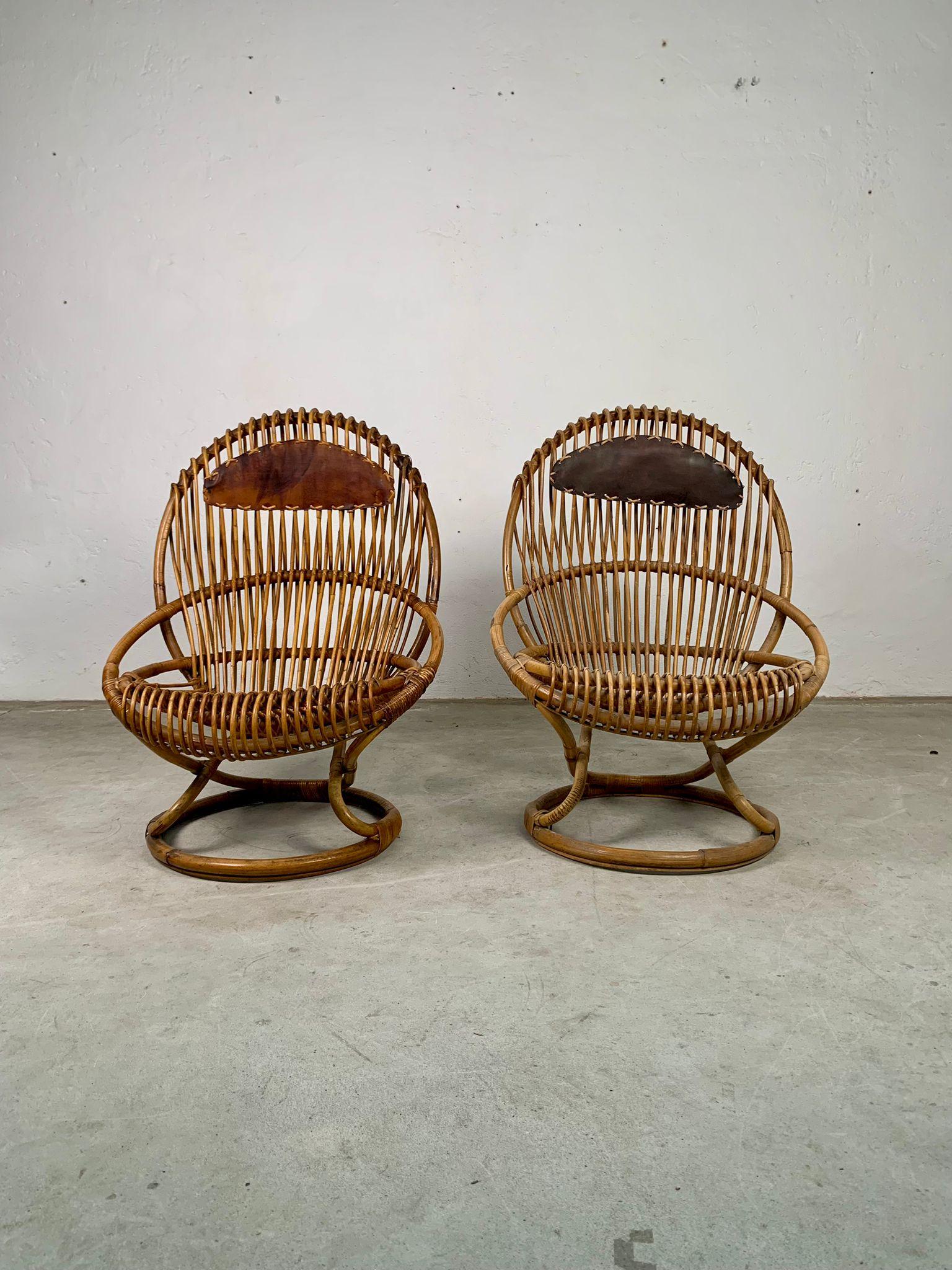 Pair of rattan armchairs mod. Tre cerchi by Tito Agnoli for Bonacina, Italy, 1960s 
Armchairs mod. Tre Cerchi with round rattan base. The structure is based on three intersecting circles that intertwine to form the seat, back and base. At the top of