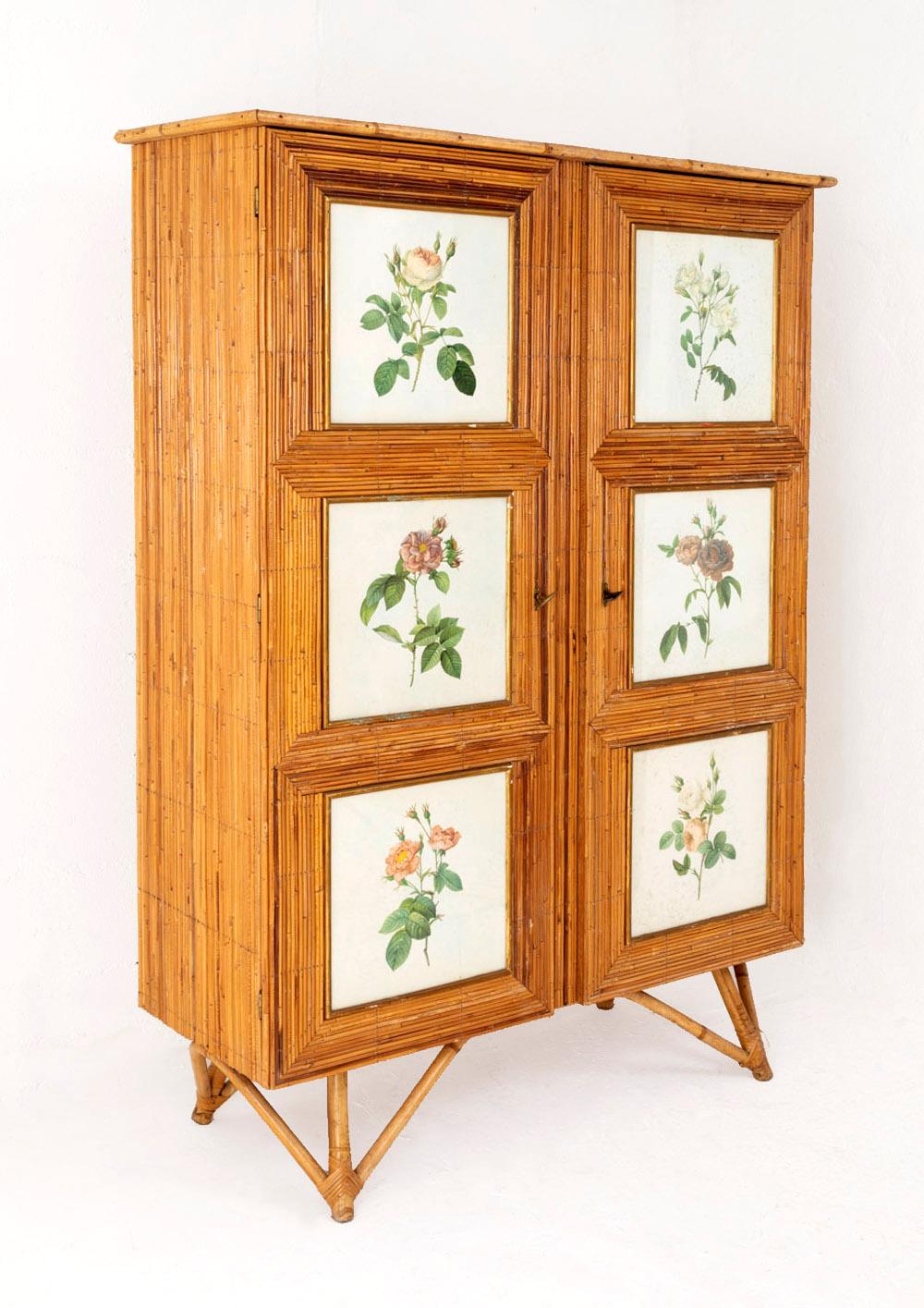 Armoire covered with rattan. Opening by two drop leaves, each one is adorned with white paper engravings under glass representing different colored roses in the style of Pierre-Joseph Redouté. Rattan sticks tripod legs on each angle.
Furniture