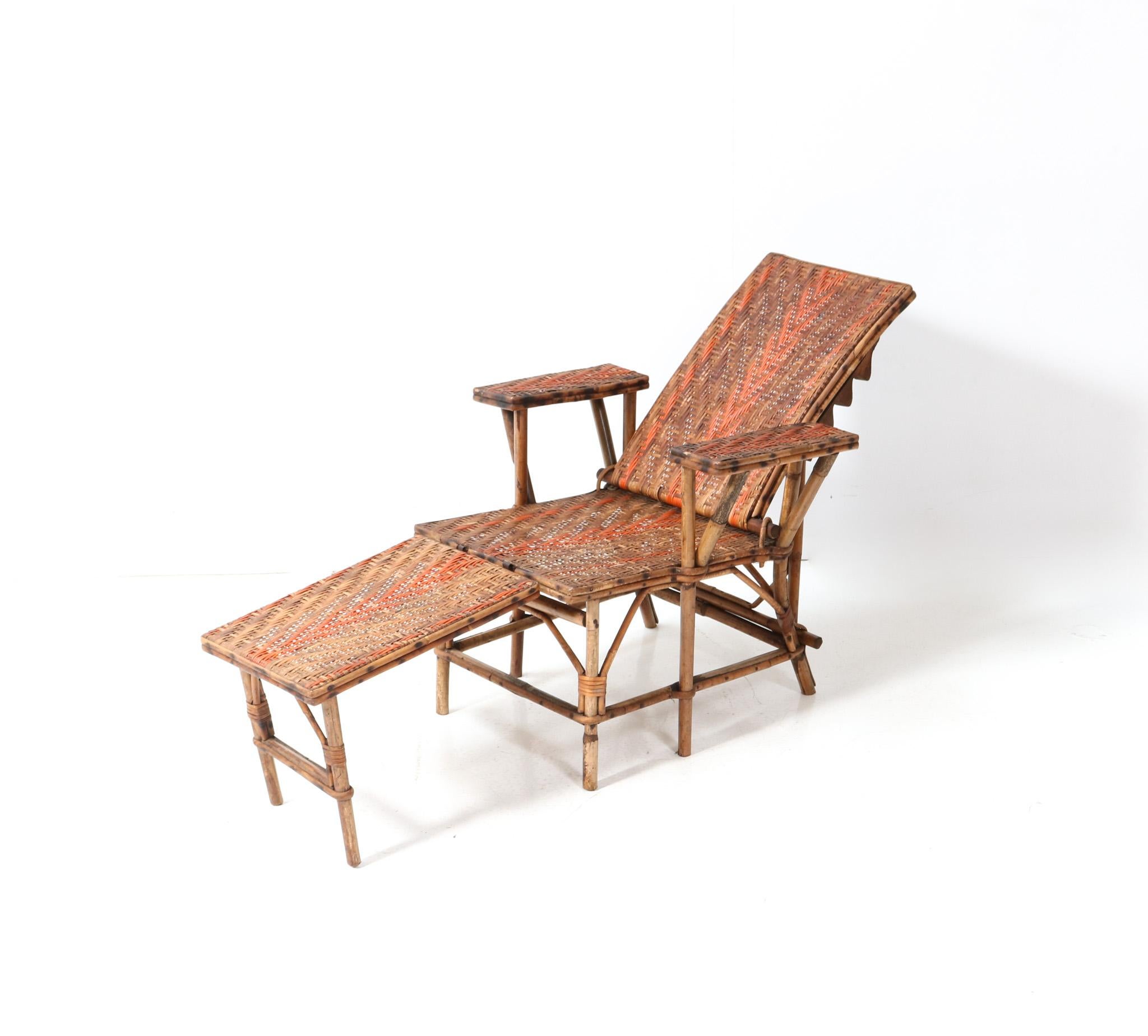Stunning and rare Art Nouveau children's folding deck chair or lounge chair.
Striking French design from the 1900s.
Rattan and bamboo frame with original rattan and bamboo foot stool.
Measurements foot stool: H: 33 cm or 12.99 in x W: 40 cm or
