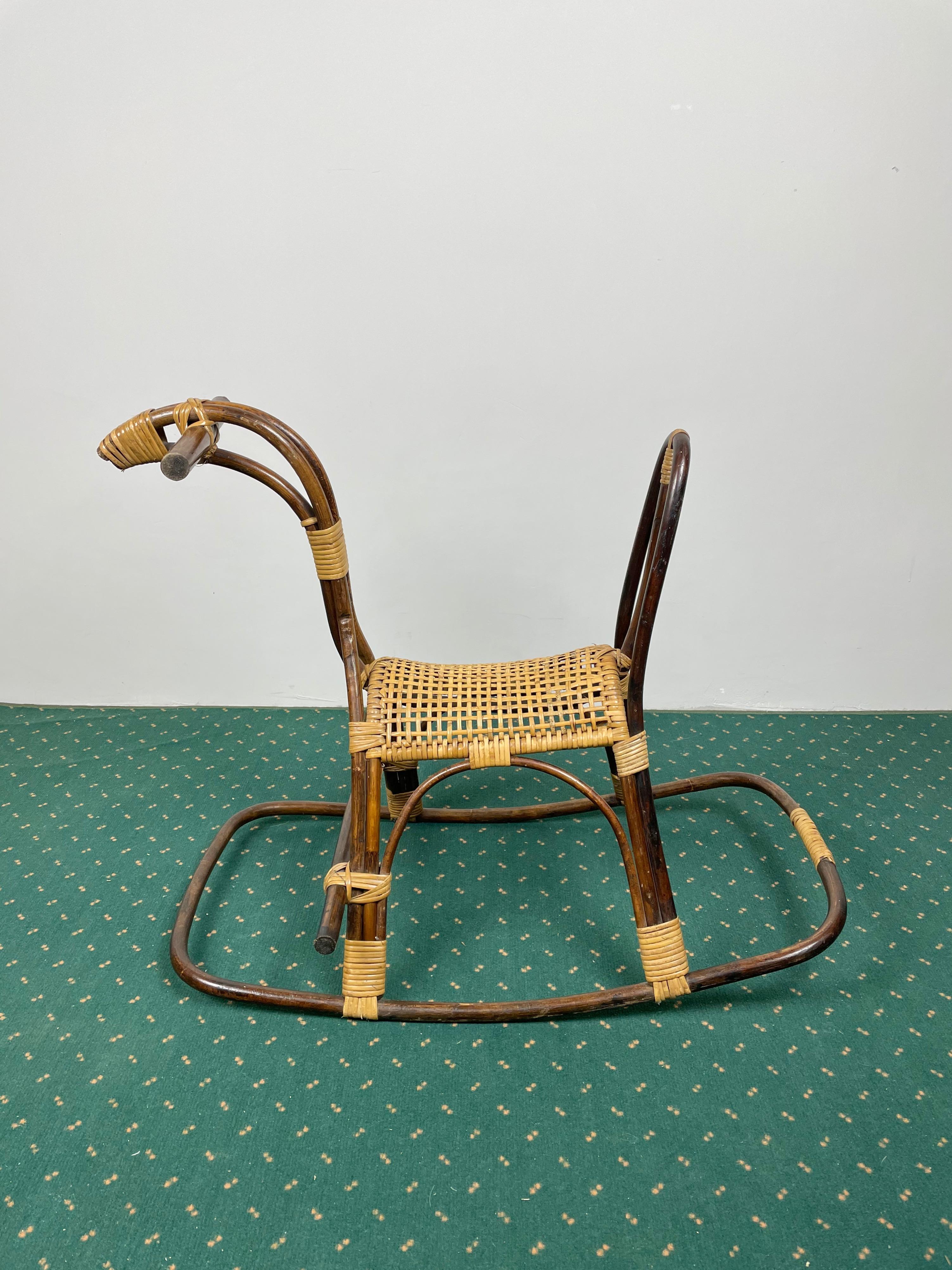 Rattan, bamboo and wicker child's rocking horse with basketweave seat. Made in Italy in the 1960s.