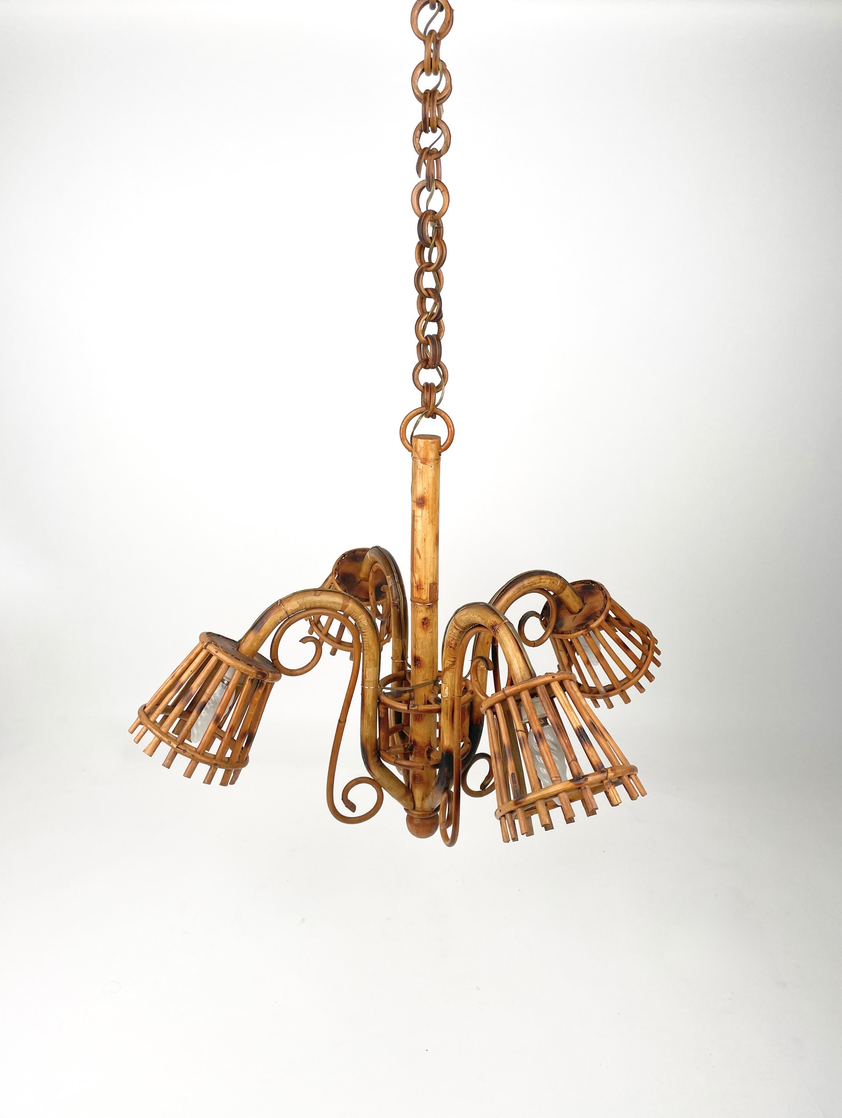 1960s chandelier pendant in bamboo and rattan featuring four lights in the style of French designer Louis Sognot. 

Measures: Height without chain: 50 cm
Diameter: 65 cm


Louis Sognot was a French designer best known for his elegant furniture
