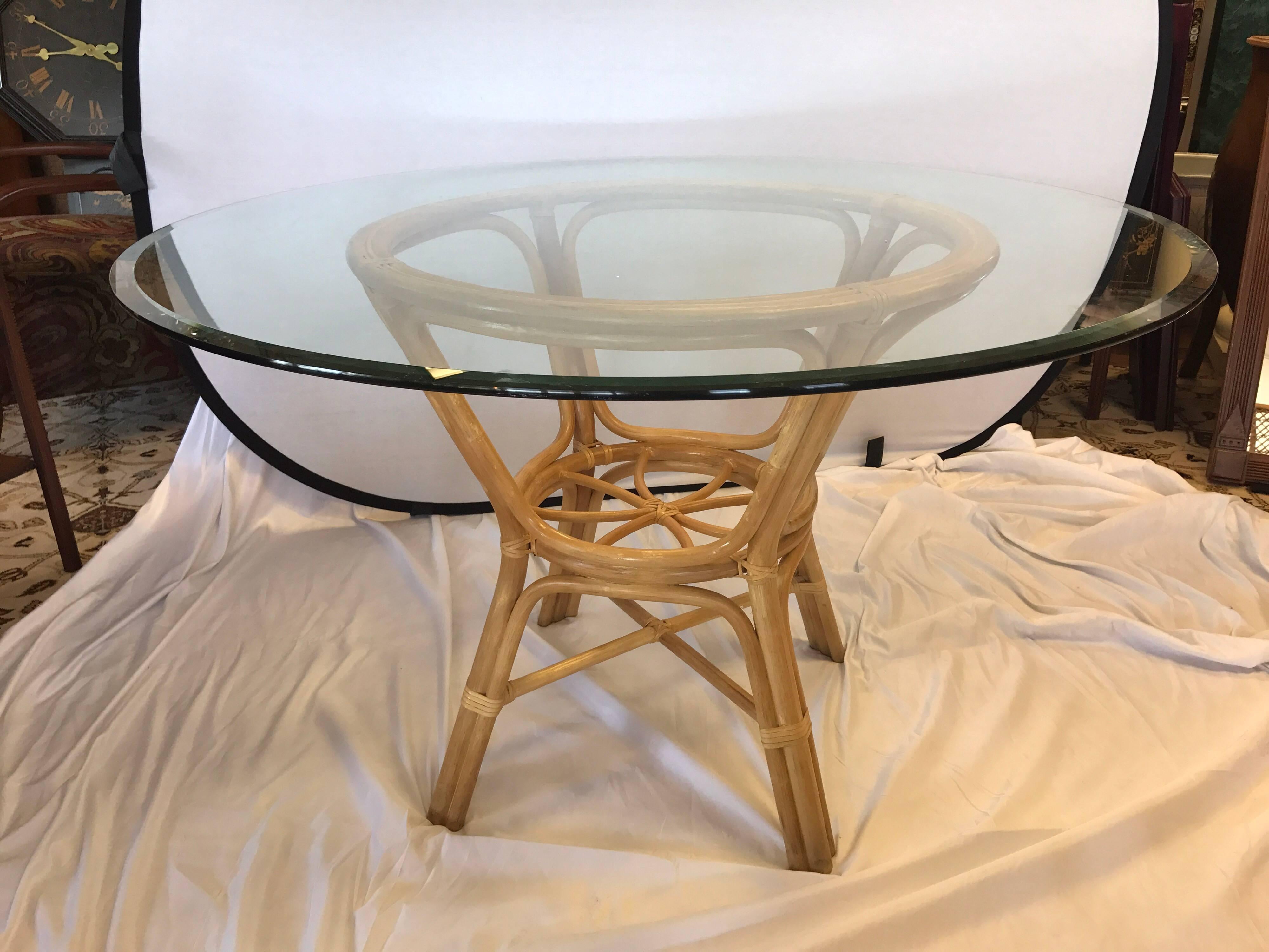 Elegant Mid-Century Modern rattan bamboo set in mint condition. Features glass top table and four large dining chairs. Perfect for kitchen, dining room our three season porch!