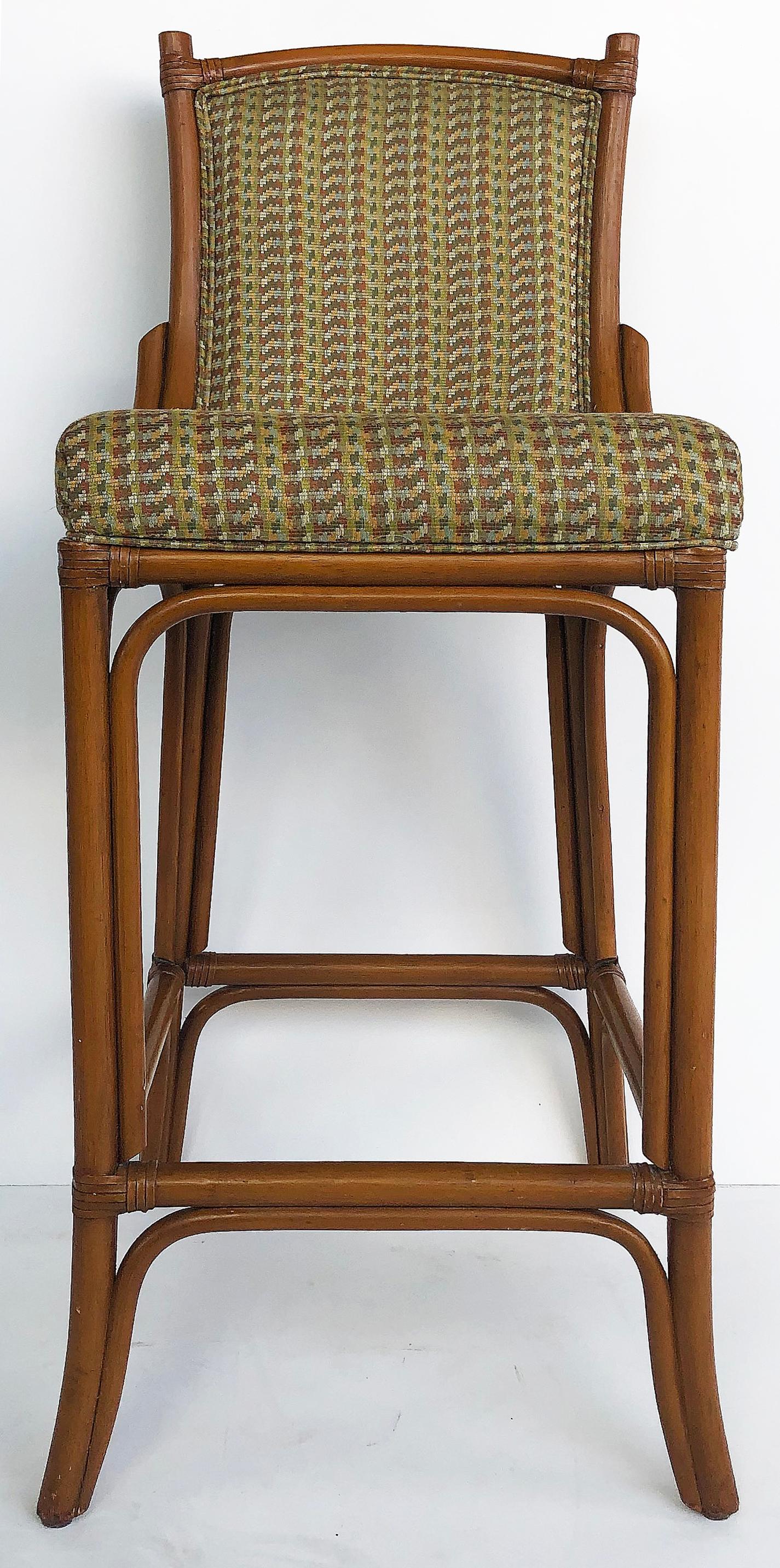 Rattan Look Bar Stools with Leather Wrapping John McGuire Attributed, Pair

Offered by the pair are wood rattan look bar stools with leather straps attributed to McGuire of San Francisco. These stools are being sold as pairs with 4 pairs available
