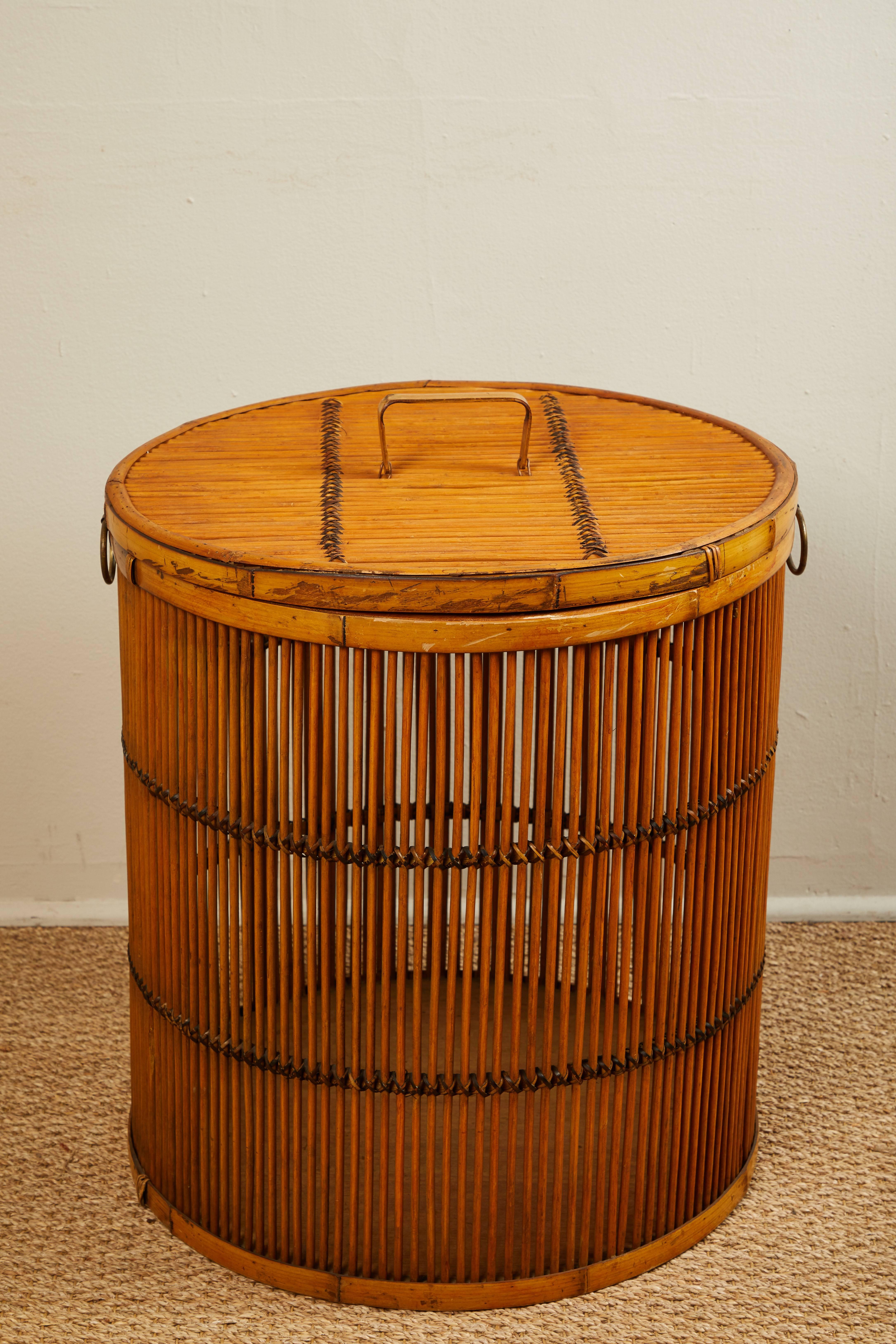 Vintage rattan laundry basket with fitted top.
 