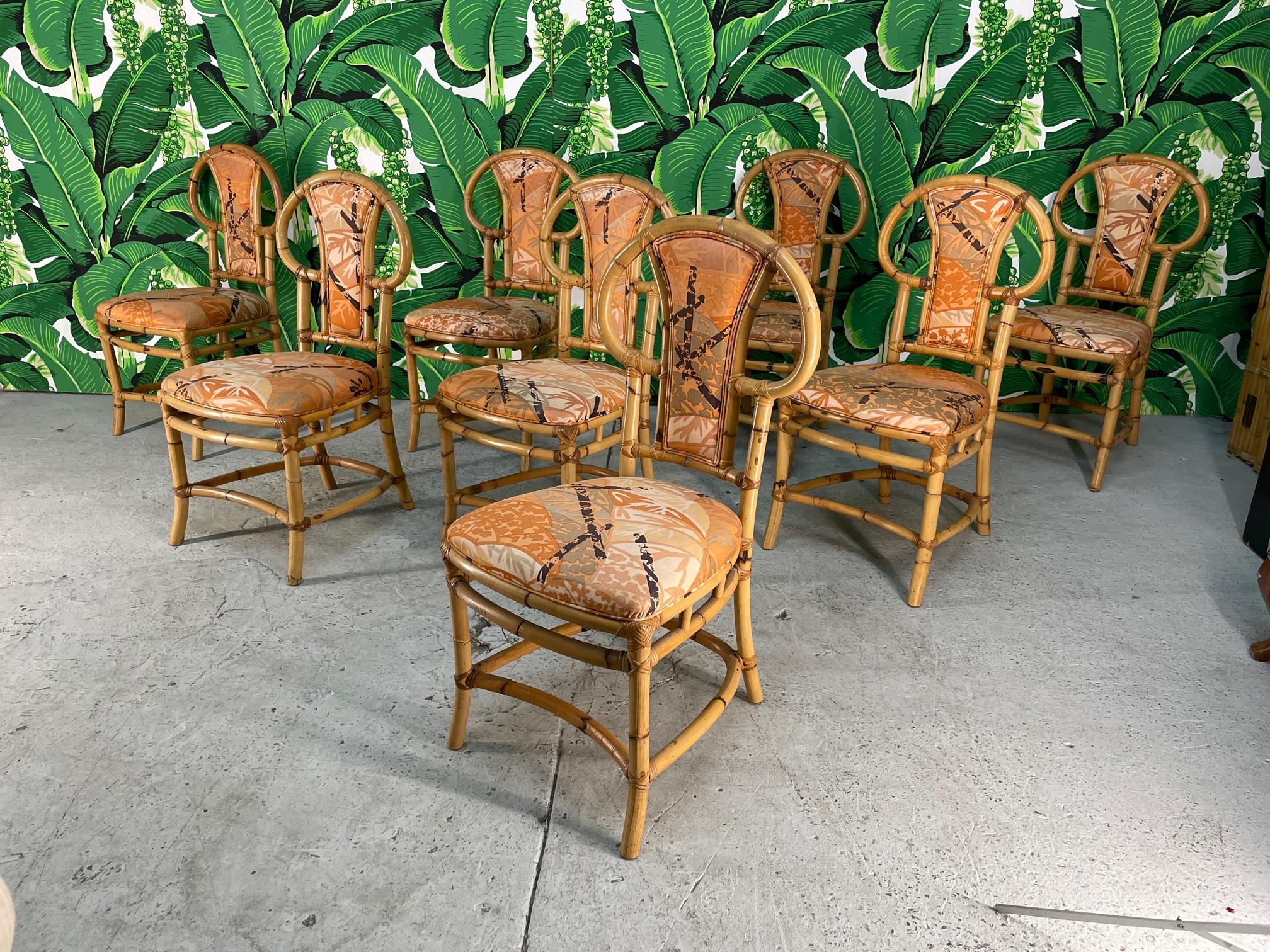 Set of eight rattan dining chairs by Henry Olko for Willow and Reed, circa 1975. Excellent condition with only minor imperfections consistent with age.